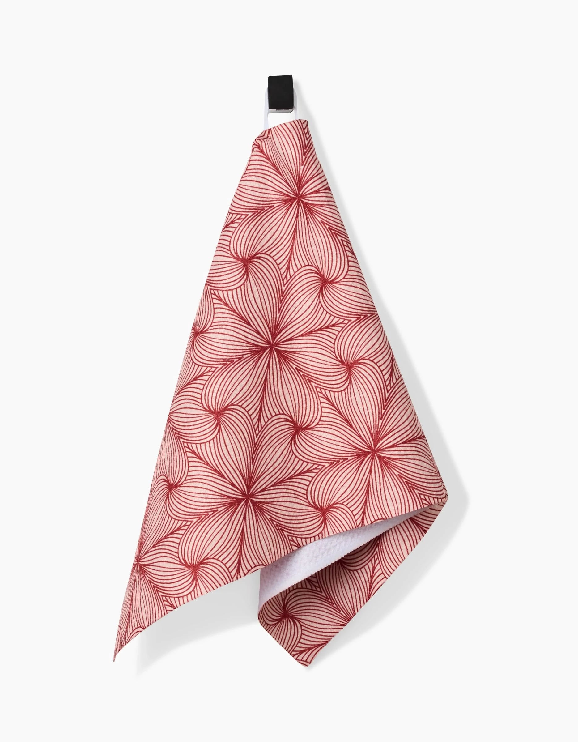 A Marta Harvey Lined bar towel in red and white, featuring a geometric wavy pattern and Geoweave fabric, hangs from a black hook against a plain white background.