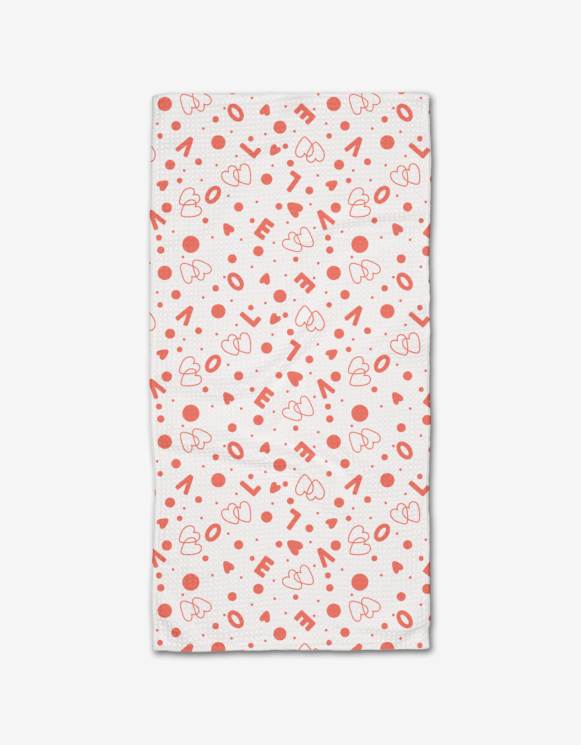 The “Love Party” bar towel from Charlie Rowan Designs is ultra-absorbent, white, and features a playful pattern of red hearts, dots, and scattered “LOVE” lettering.