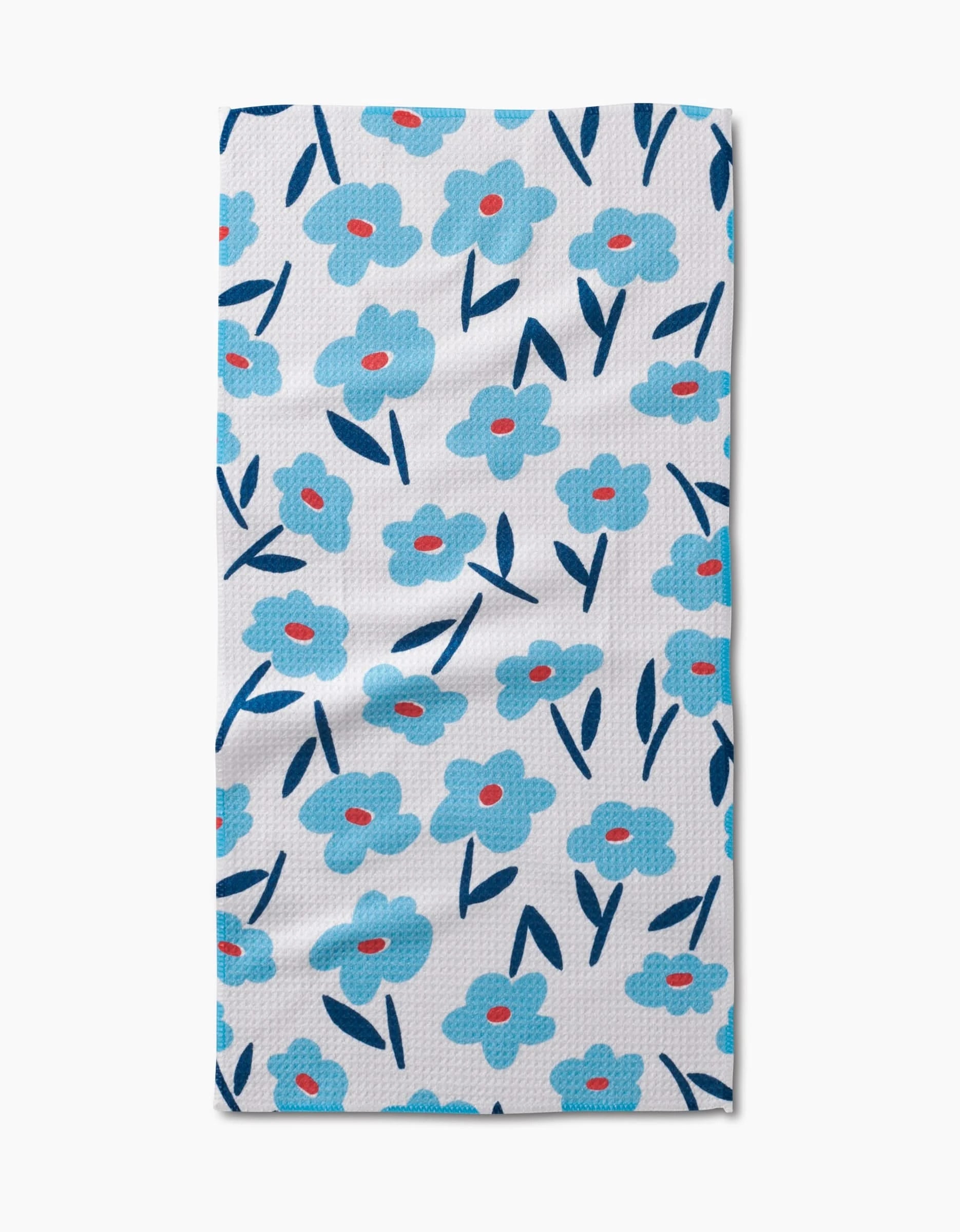 The Hufton Studio Luca Daisy is a rectangular white bar towel showcasing blue flowers with red centers and dark blue leaves, all on absorbent Geoweave fabric for stylish function.