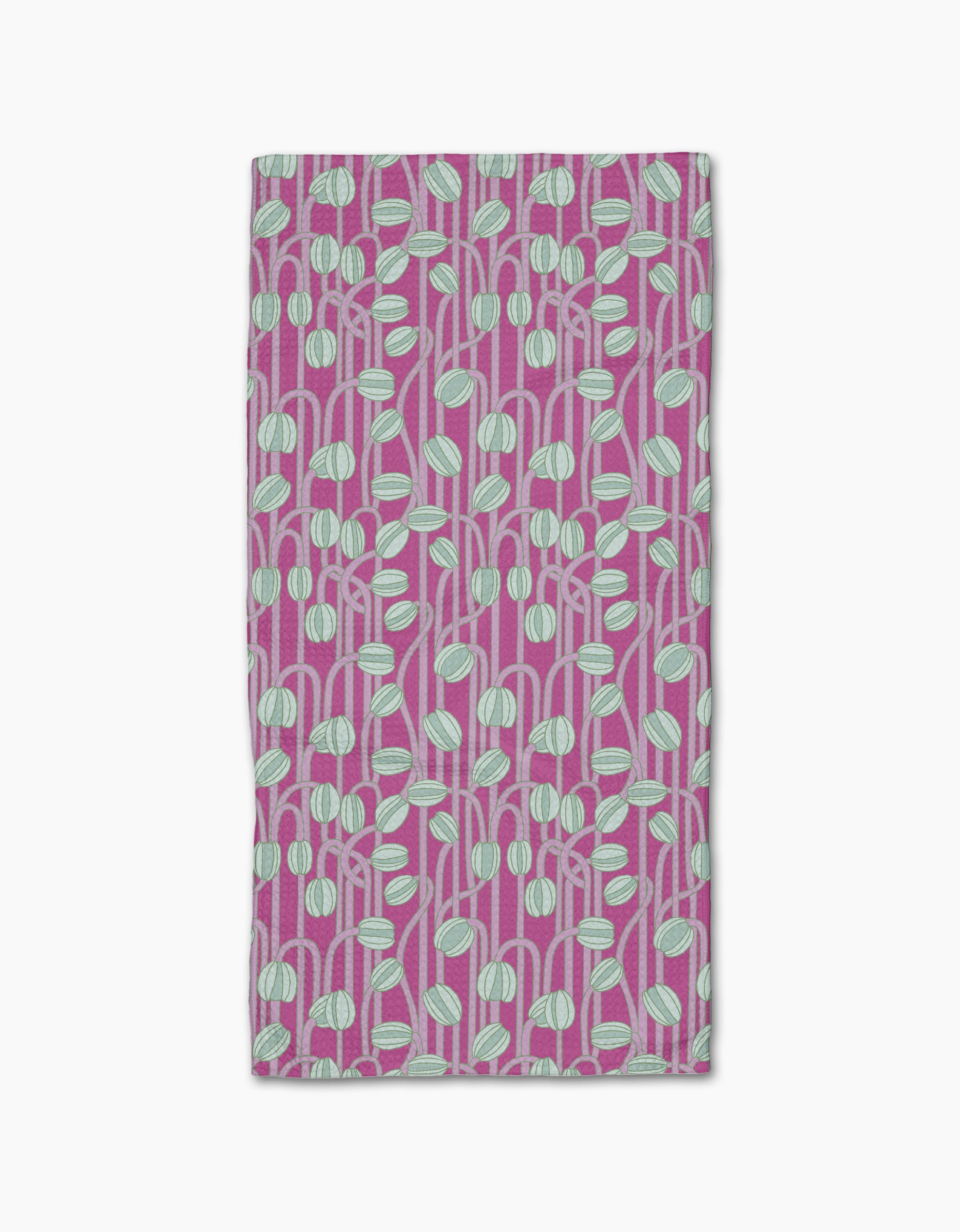The Magenta Poppy Pods bar towel by Katie OShea is ultra-absorbent and rectangular, featuring a modern, botanical pattern of light blue and white rounded leaf shapes with stems on a magenta background.