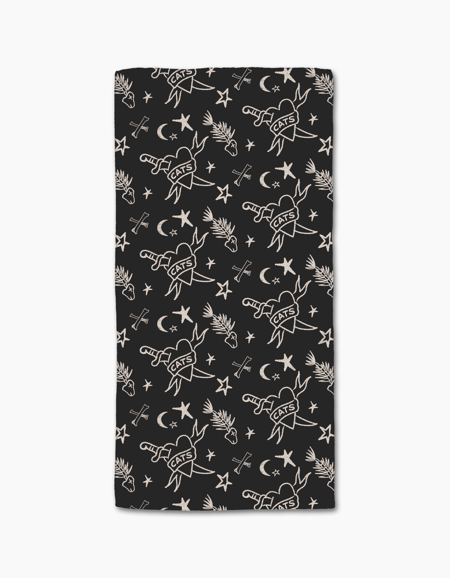 The Meow or Never bar towel by Cole Strem is a black, rectangular towel made from post-consumer recycled materials. It features white line art tattoo motifs—CATS hearts, birds, stars, moons, and flowers—on repeat.