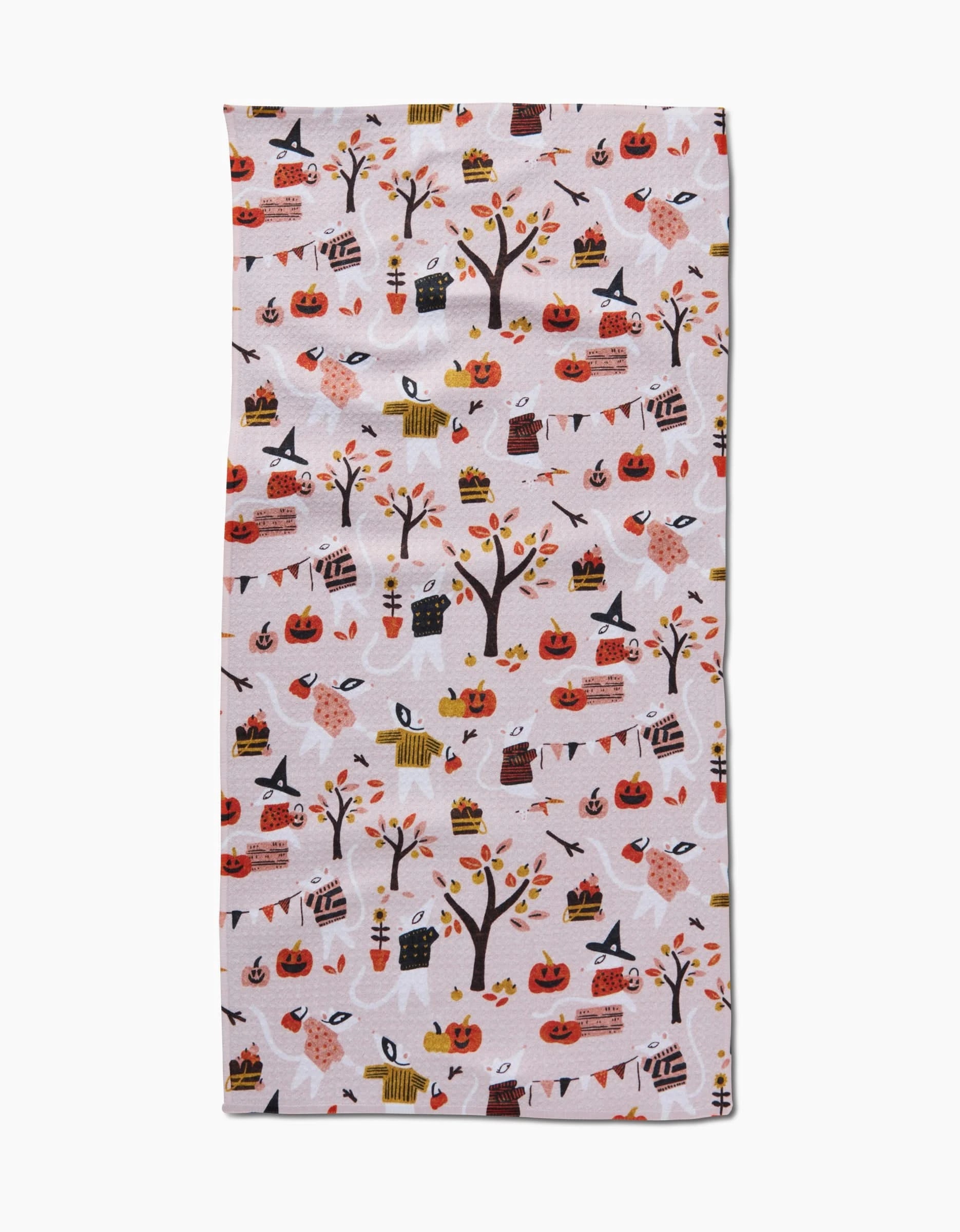 The Morticia kitchen towel by Amy MacCready is rectangular, made from recycled materials, and features a festive autumn and Halloween design with pumpkins, trees, leaves, pies, owls, and bunting in warm hues on a light background.