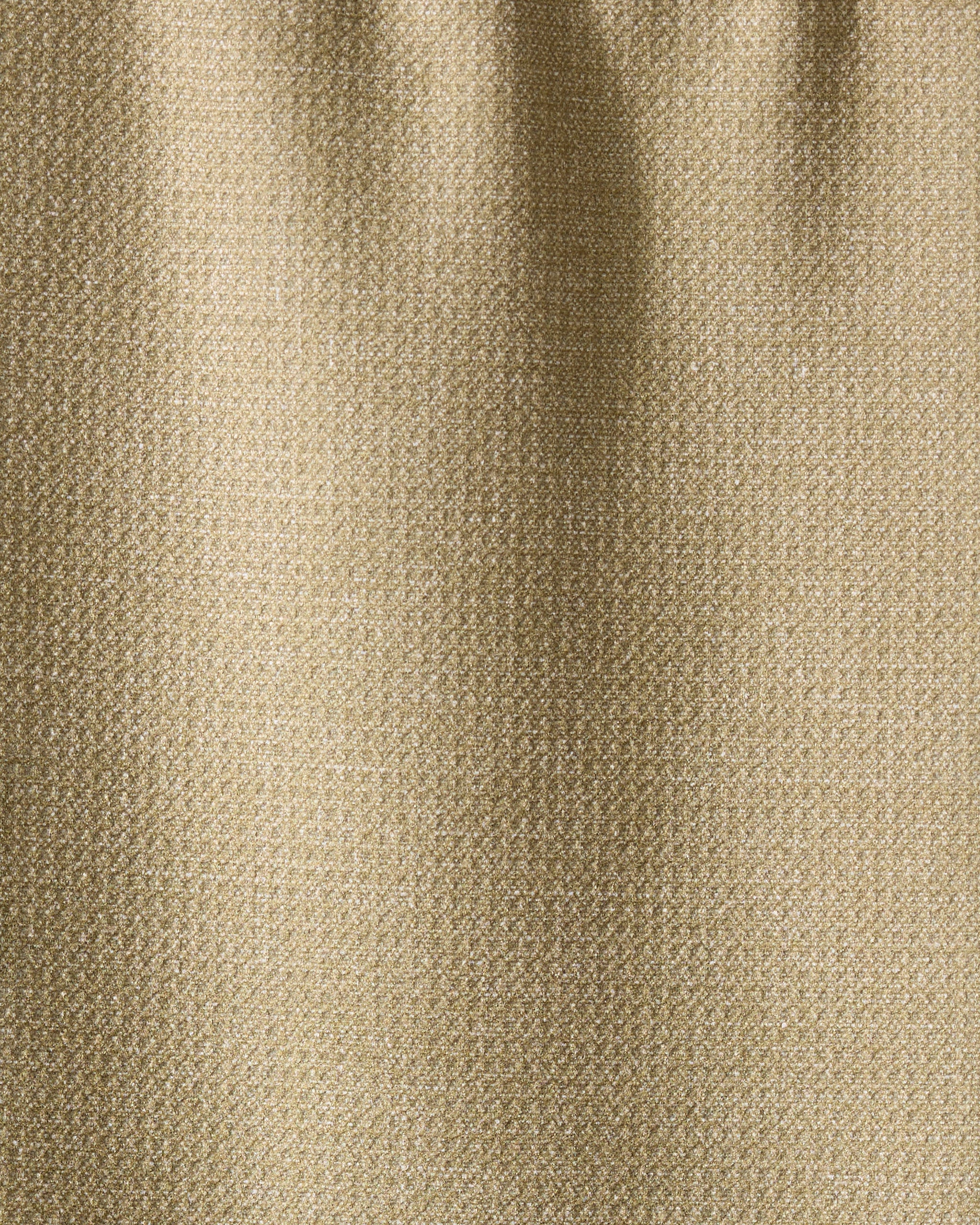 Close-up of Geometrys Mosswood towel in textured beige fabric, featuring a subtle weave pattern and soft vertical folds. The ultra-absorbent surface has a slight sheen, reflecting light gently.
