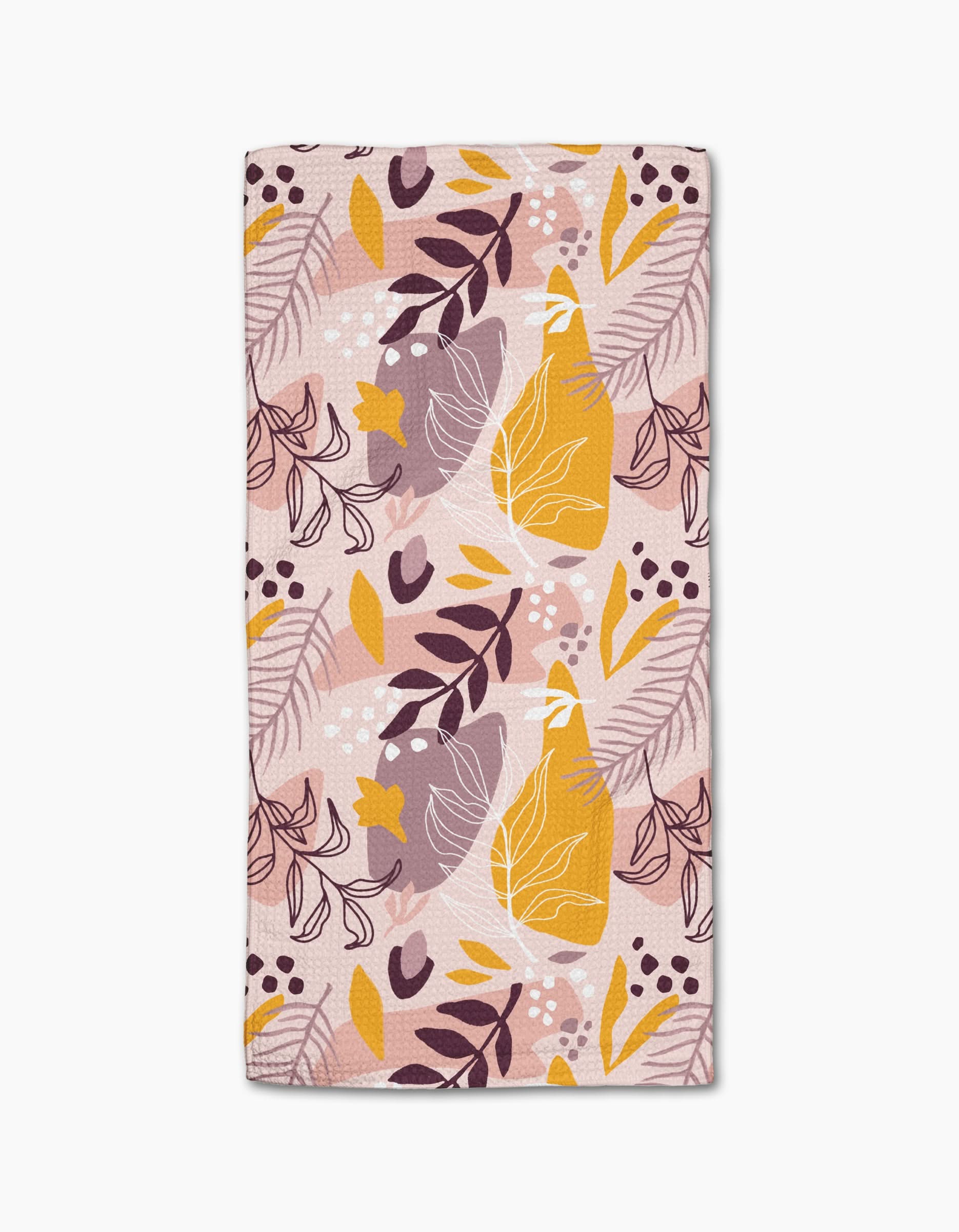 The Nature Sketch towel by Cottonflower Studio is a rectangular, ultra-absorbent bar towel with an abstract botanical design in pastel pink, yellow, purple, and white leaves on light pink—ideal as a stylish decorative accent.