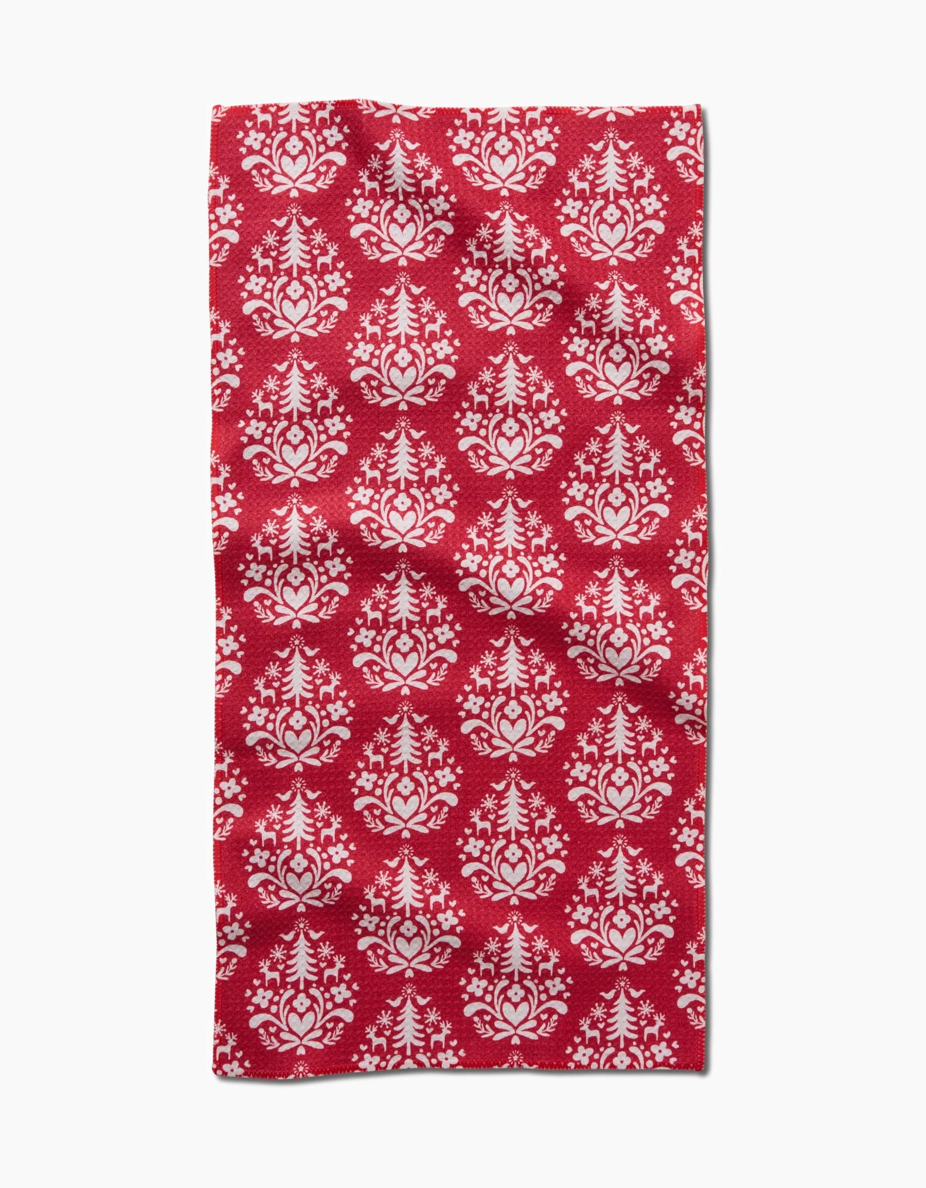 The Kayla Ann Nordic Holiday Stamp Red towel is an ultra-absorbent, recycled material towel with a white floral damask pattern, shown flat with visible folds and creases.