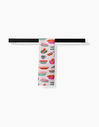 The Orla Bar Towel by Amy MacCready features vibrant illustrations of cups, dishes, and utensils. Made with durable Geoweave fabric, it offers style and superior absorbency—shown hanging from a sleek black bar on a white background.