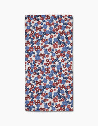 The Painted Petals Bar Towel by Ashley Celena features small, overlapping red, blue, and navy floral shapes on white Geoweave fabric for ultra-absorbency.