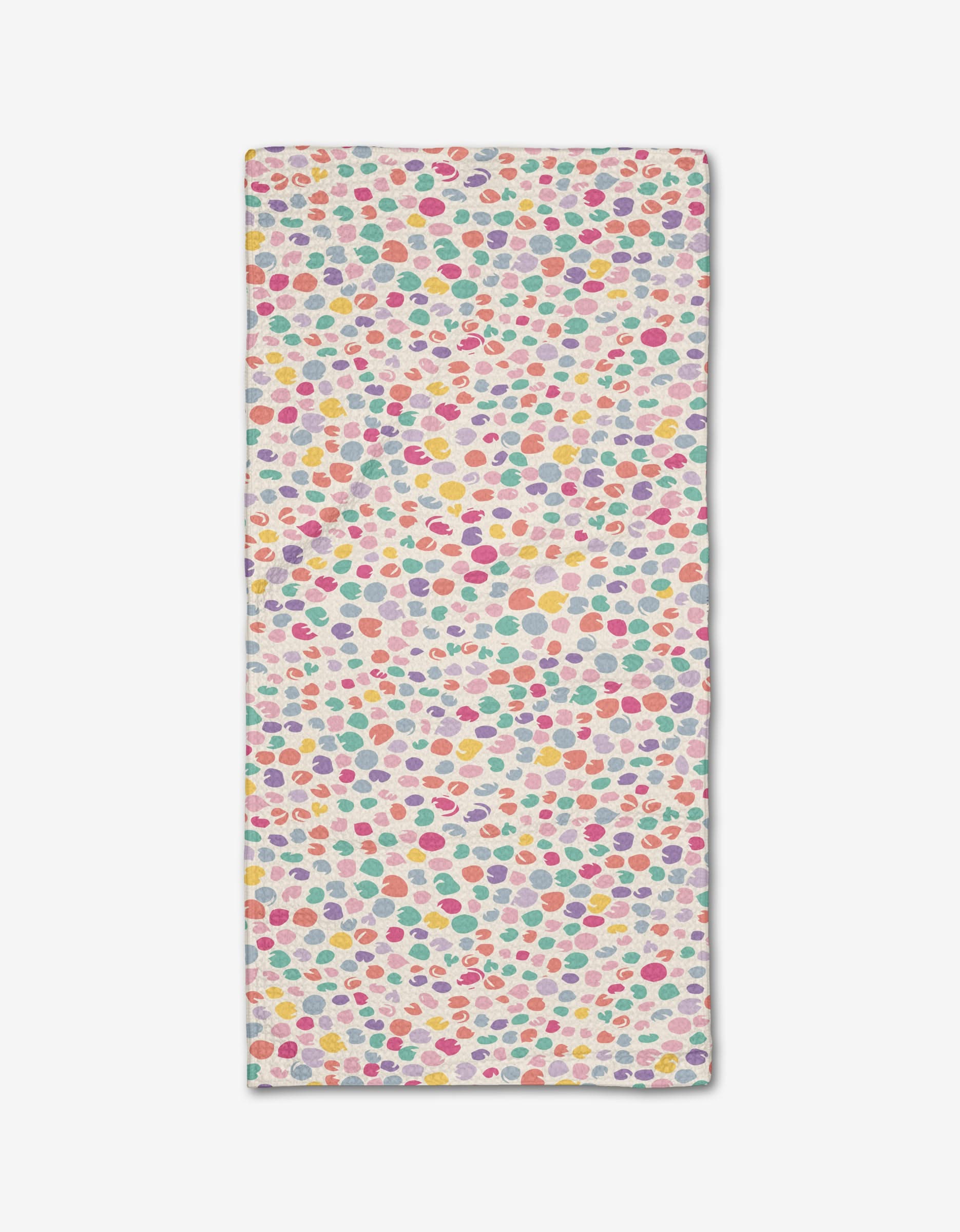 The Pastel Petal bar towel by Rebecca Bobko features pink, yellow, red, green, and purple polka dots on a white background. Made from eco-friendly Geoweave fabric.