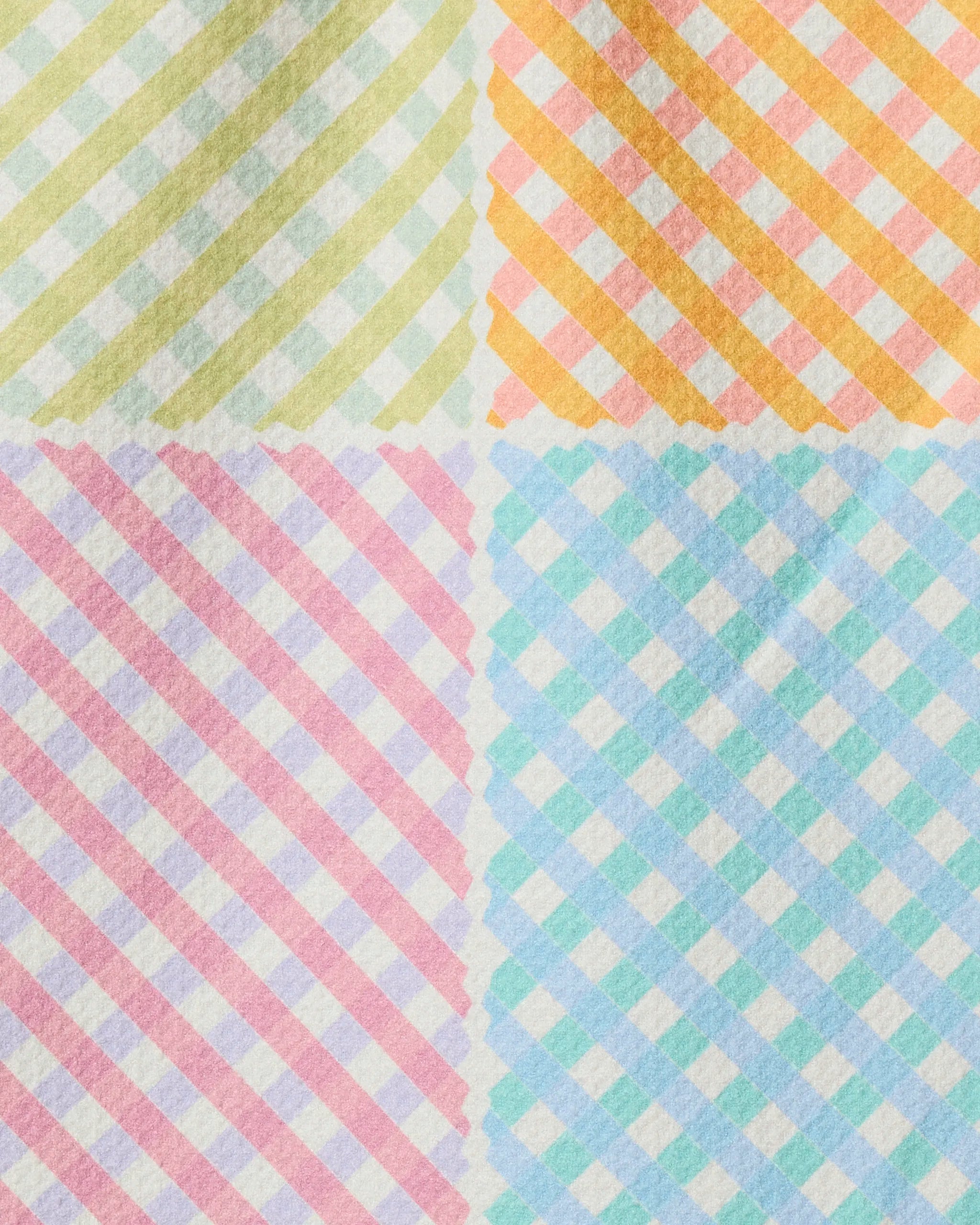 The Geometry Patio Check features a diagonal gingham pattern with yellow-green, orange, pink, and blue quadrants—ideal for a colorful, ultra-absorbent recycled kitchen towel.