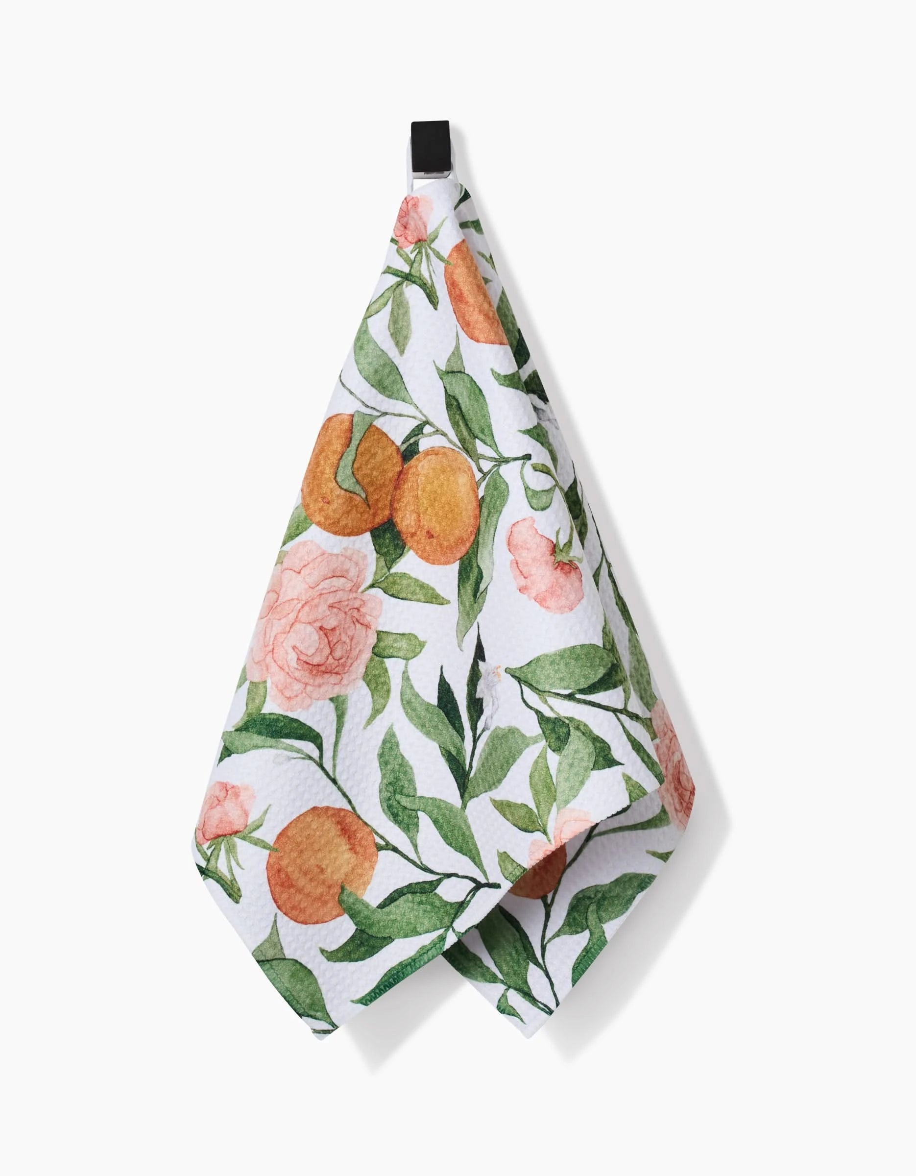 The Peony For Your Thoughts hanging bar towel by Aubrey Fairchild features orange citrus and pink flowers on ultra-absorbent Geoweave fabric, ensuring quick drying on a crisp white background.