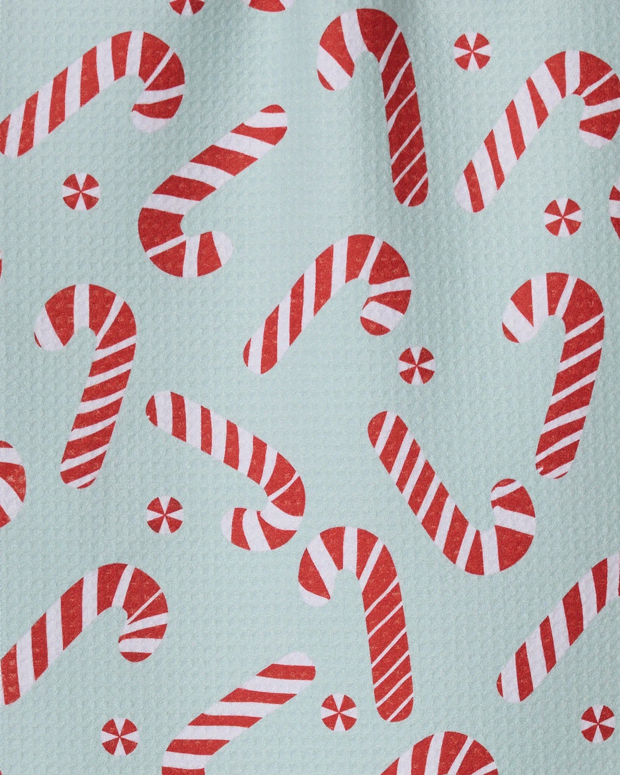 The Geometry Peppermint Twist quick-drying towel features red and white candy canes and peppermint candies on a light blue background, adding festive cheer to your holiday kitchen.