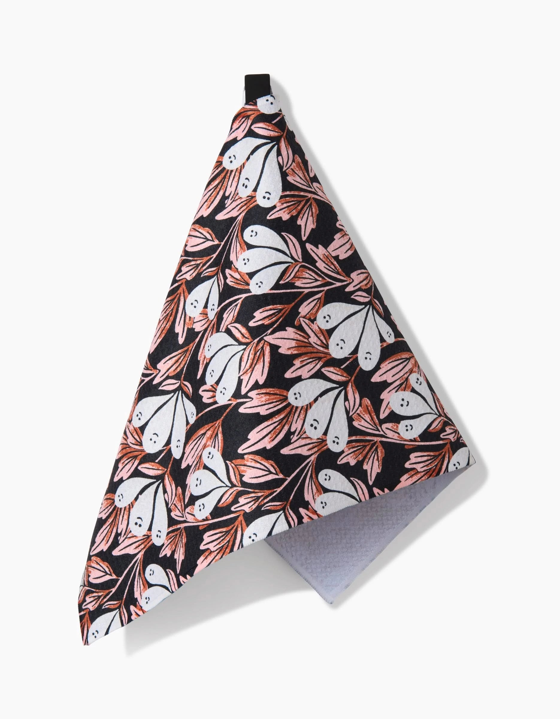 The Phantom Floral hanging kitchen bar towel by Sarah Daugherty features playful white ghosts and pink-orange leaves on a black background, crafted from recycled materials for an eco-friendly touch.