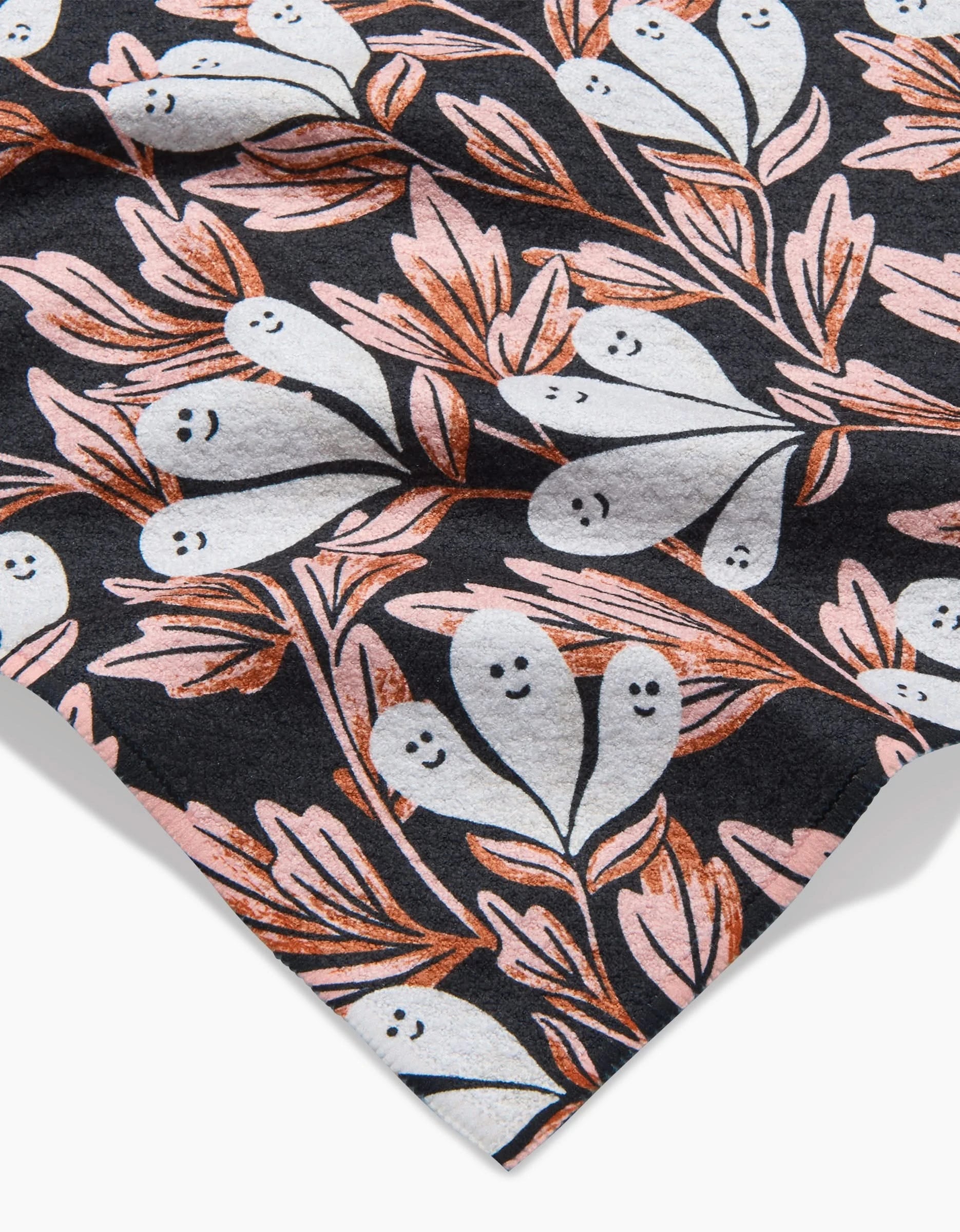 The Phantom Floral by Sarah Daugherty features Geoweave fabric with playful white ghosts, smiling faces, and pink and copper leaves on a dark background.