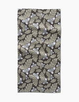 The Danelys Sidron Pinecone Patch is a rectangular, ultra-absorbent towel featuring beige oak leaves and acorns on a dark brown background, shown flat with some wrinkles visible.