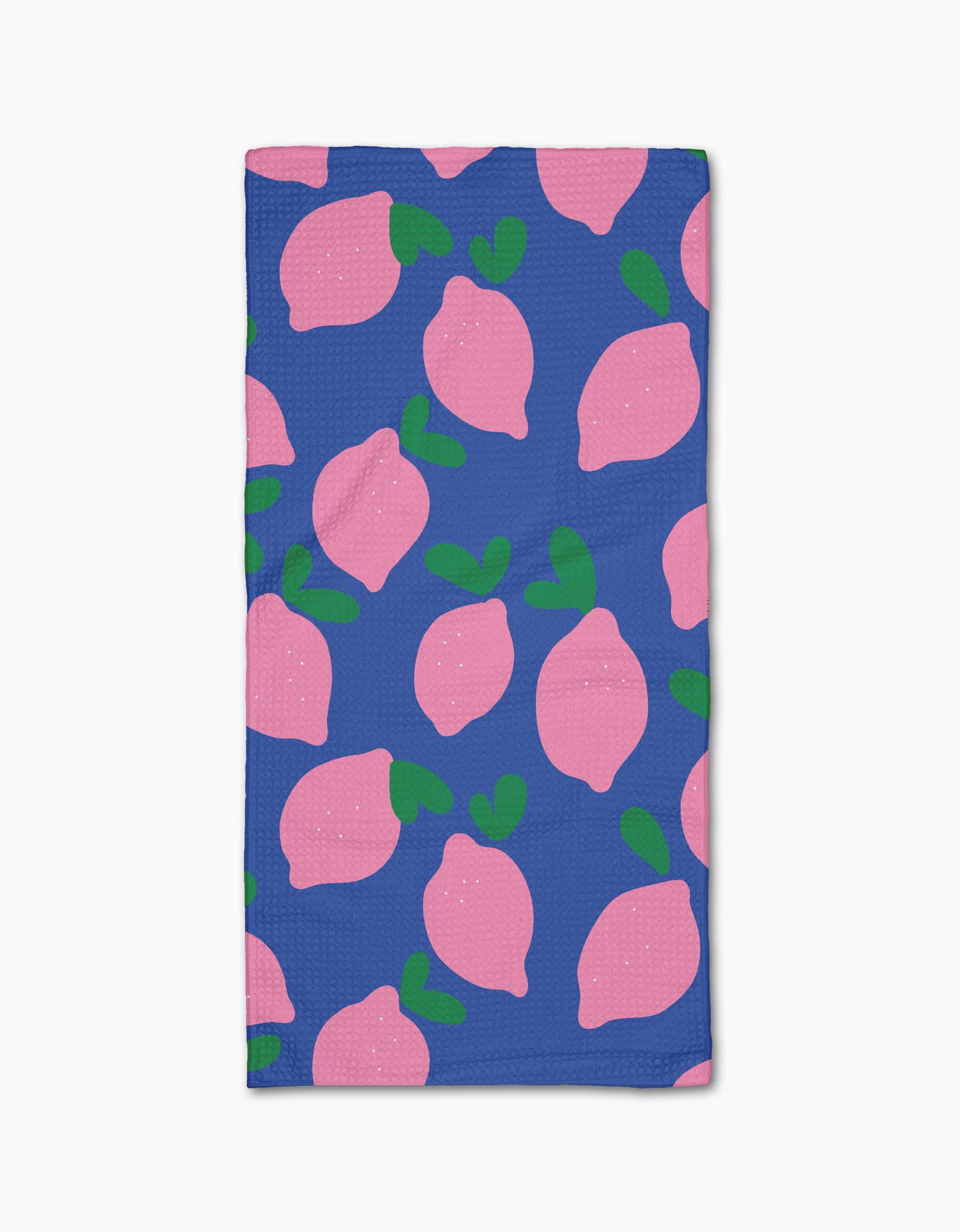 The Jennifer Bouron Pink Lemons Bar Towel features a blue background with pink lemons and green leaves, made from soft Geoweave fabric for excellent absorbency.