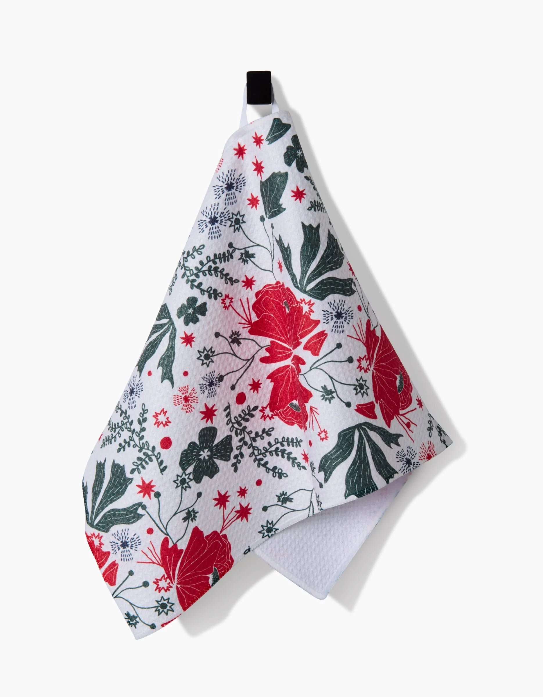 The Ash Cascade Poinsettia Bramble bar towel features ultra-absorbent white fabric with a colorful floral pattern of red flowers, green leaves, blue accents, and a convenient black hanging loop.