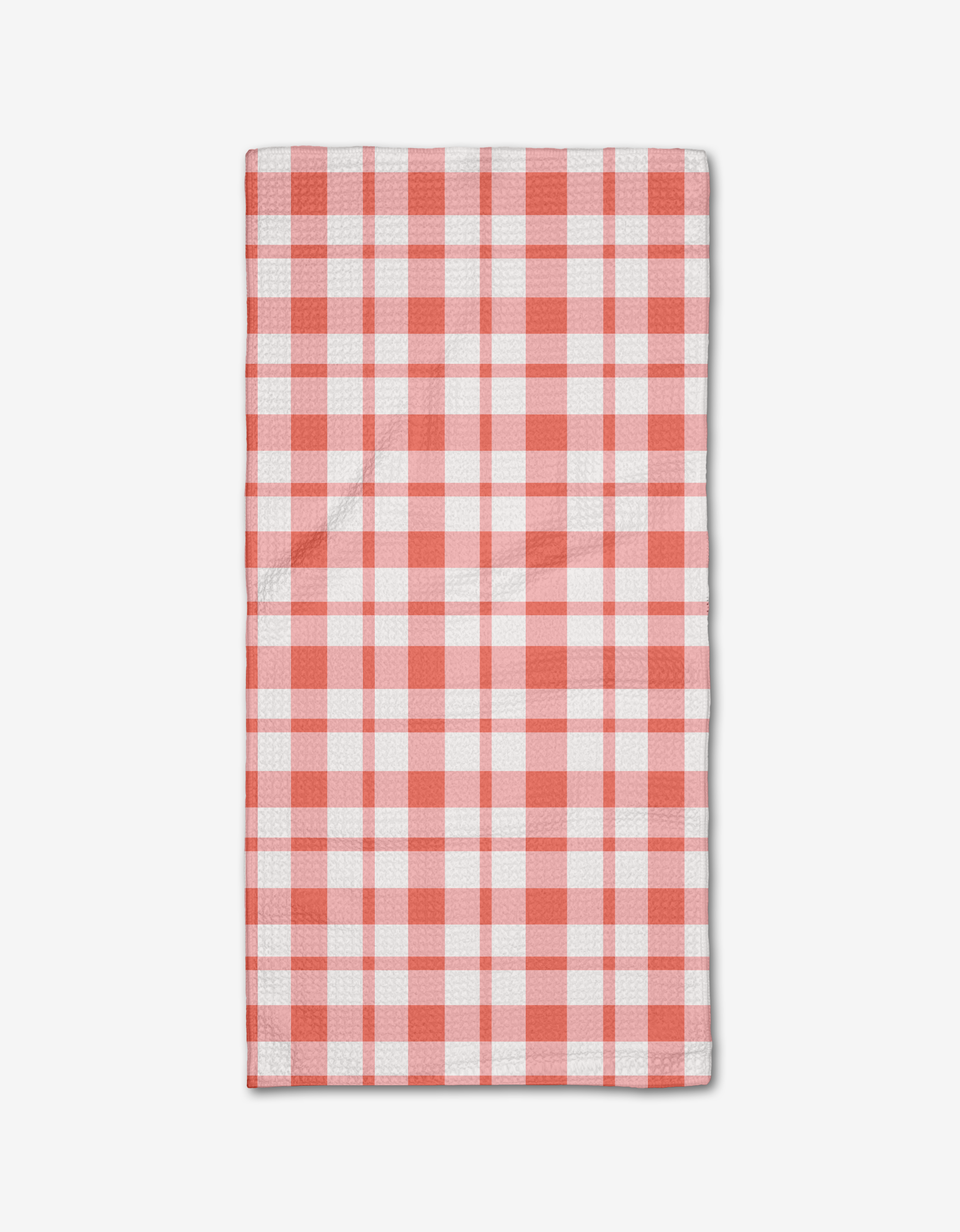The Pretty in Pink Plaid Bar Towel by Charlie Rowan Designs features a pink plaid pattern and is neatly folded on a plain white background.