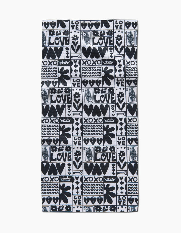 The Queen of Hearts bar towel by Kayla Ann features a black and white heart, flower, and LOVE/XOXO pattern in hand-drawn style, crafted from recycled materials.