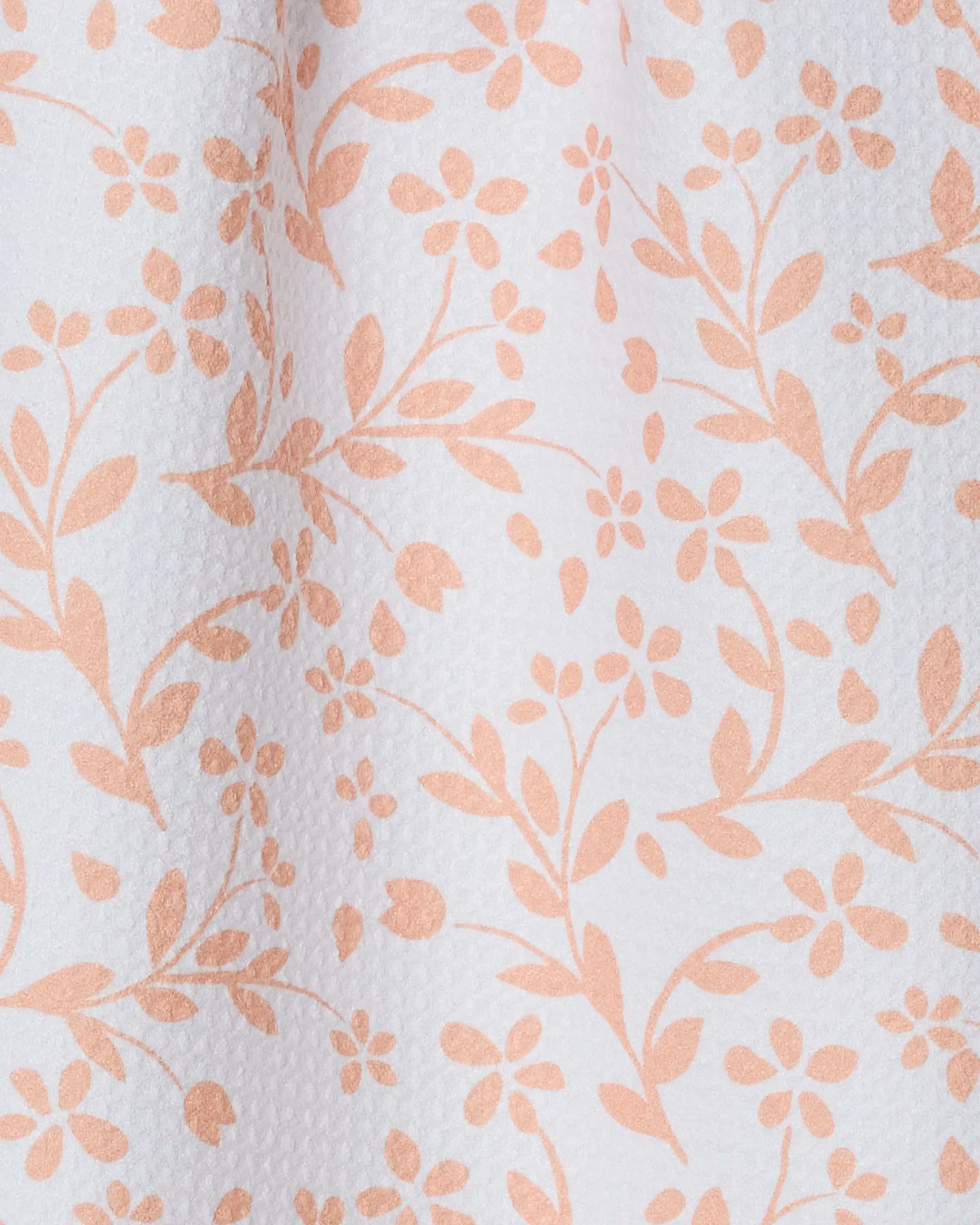 A close-up of the Quiet Floral towel by Geometry highlights its ultra-absorbent texture, crafted from recycled materials.