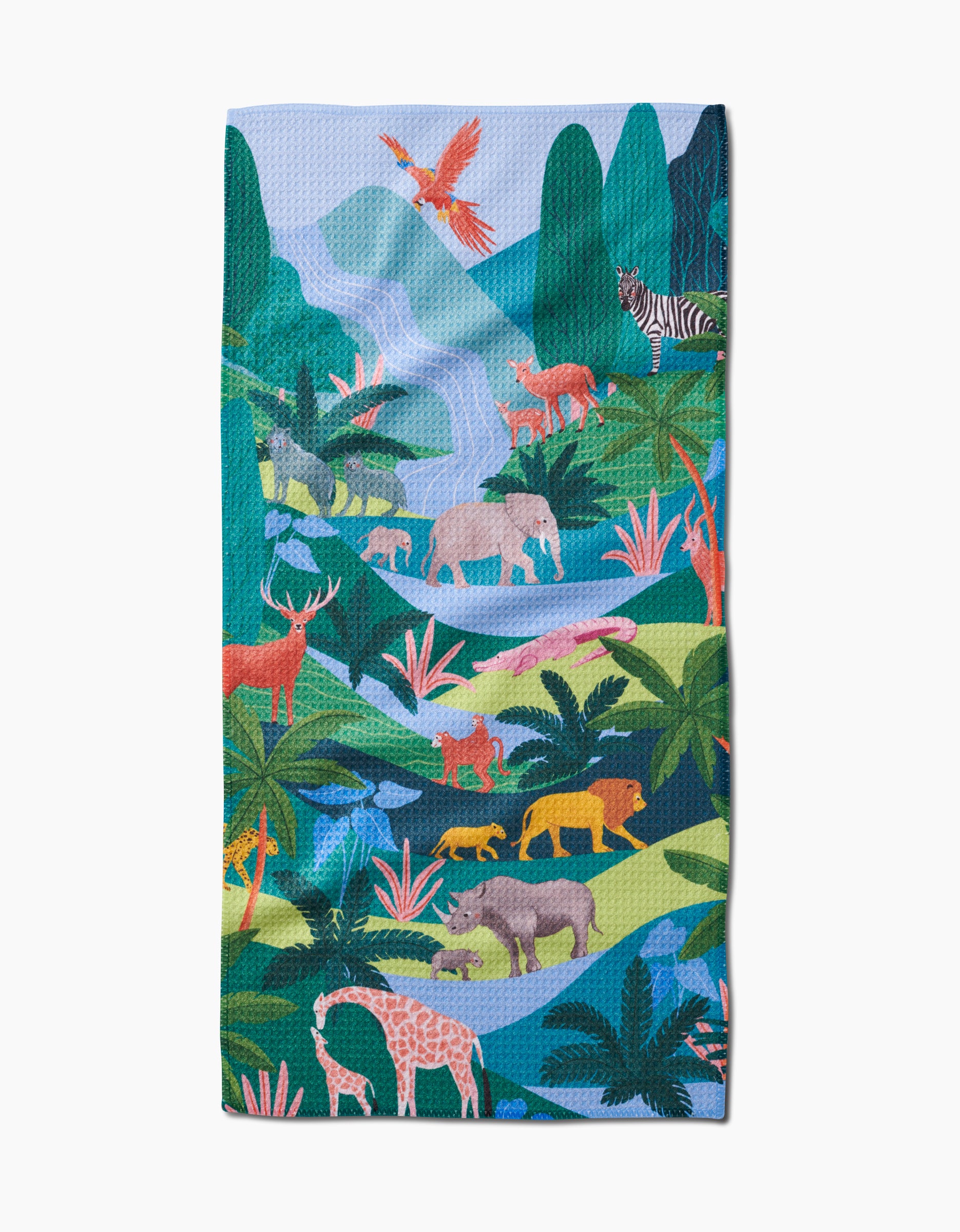 The “Rainforest” bar towel by Ceyda Alasar features illustrated jungle animals, vibrant greenery, and scenic mountains. Made from recycled materials.