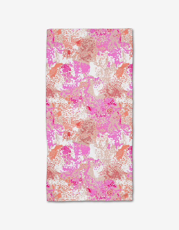 The Rawhide Bar Towel by Elisabeth Wing features an abstract, multicolored brushstroke pattern in pink, coral, orange, and white on Geoweave fabric.