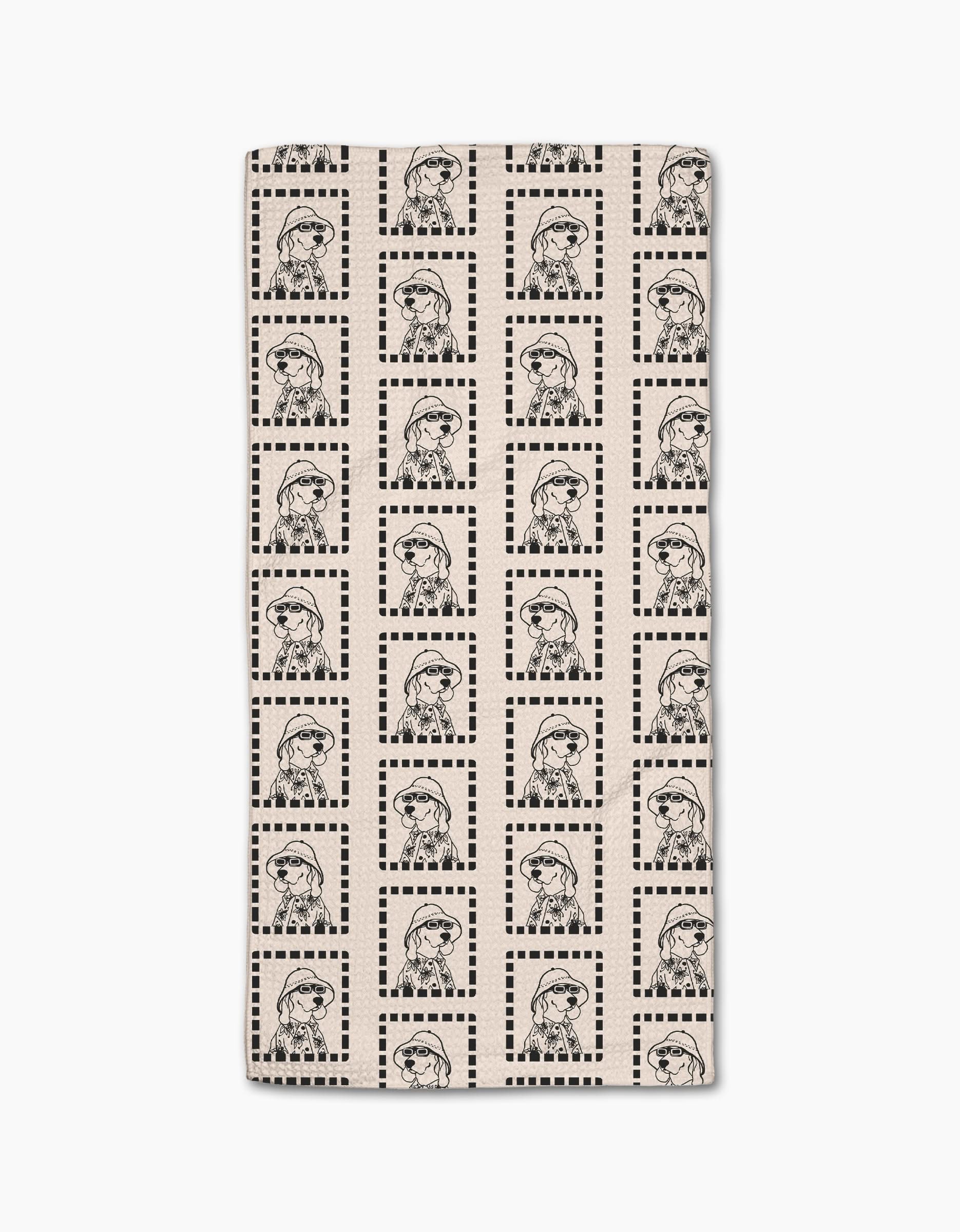 The Geometry Ready For Summer Doggy Bar Towel is rectangular, beige, and features a soft Geoweave fabric with a black line art pattern of a girl in a beret and striped shirt inside checkered squares.
