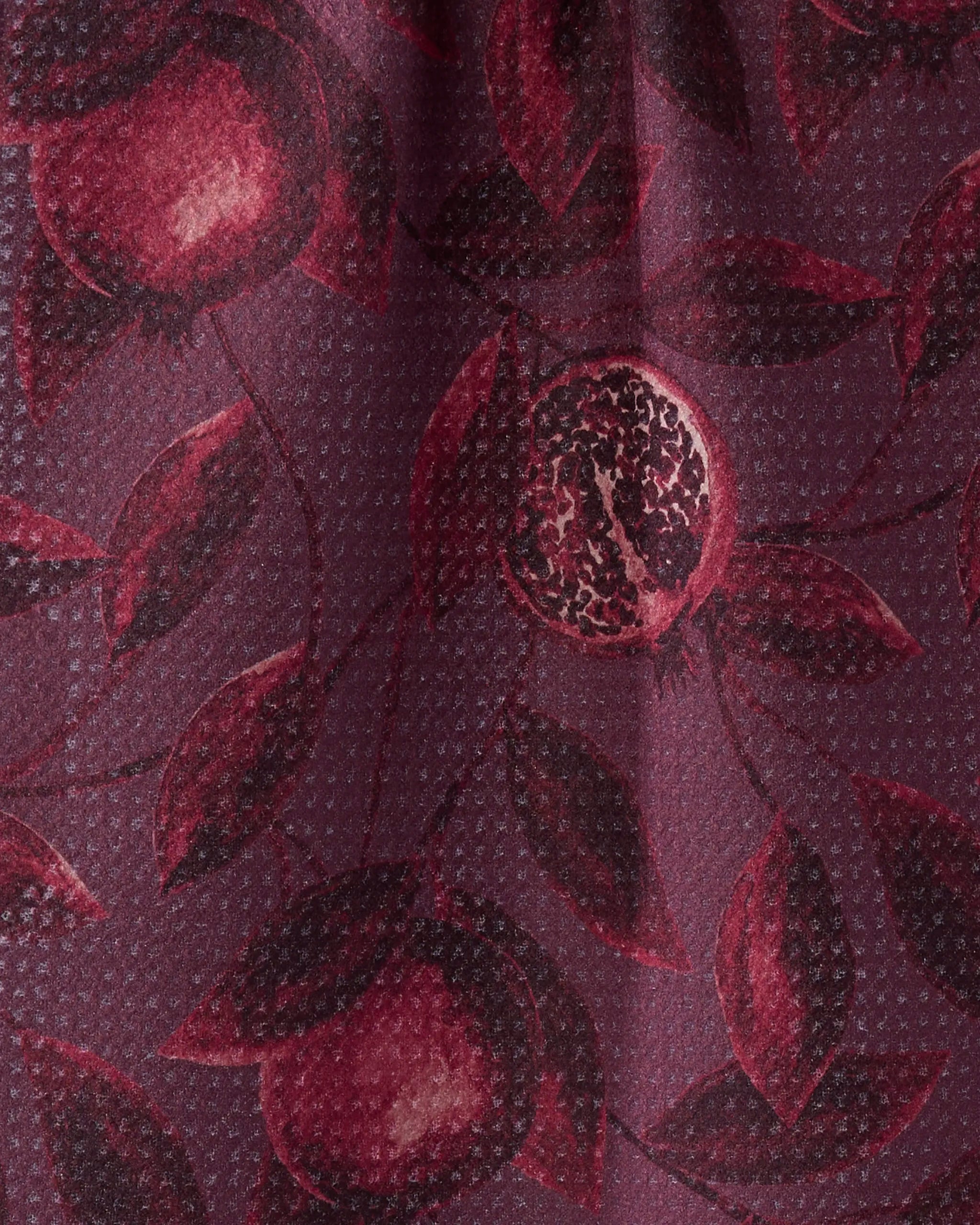 Close-up of Geometry’s Rich Garnet bar towel, ultra-absorbent and crafted from recycled materials. The maroon, dark red pomegranate-inspired pattern and subtle dotted texture highlight the fabric’s softness and eco-friendly design.