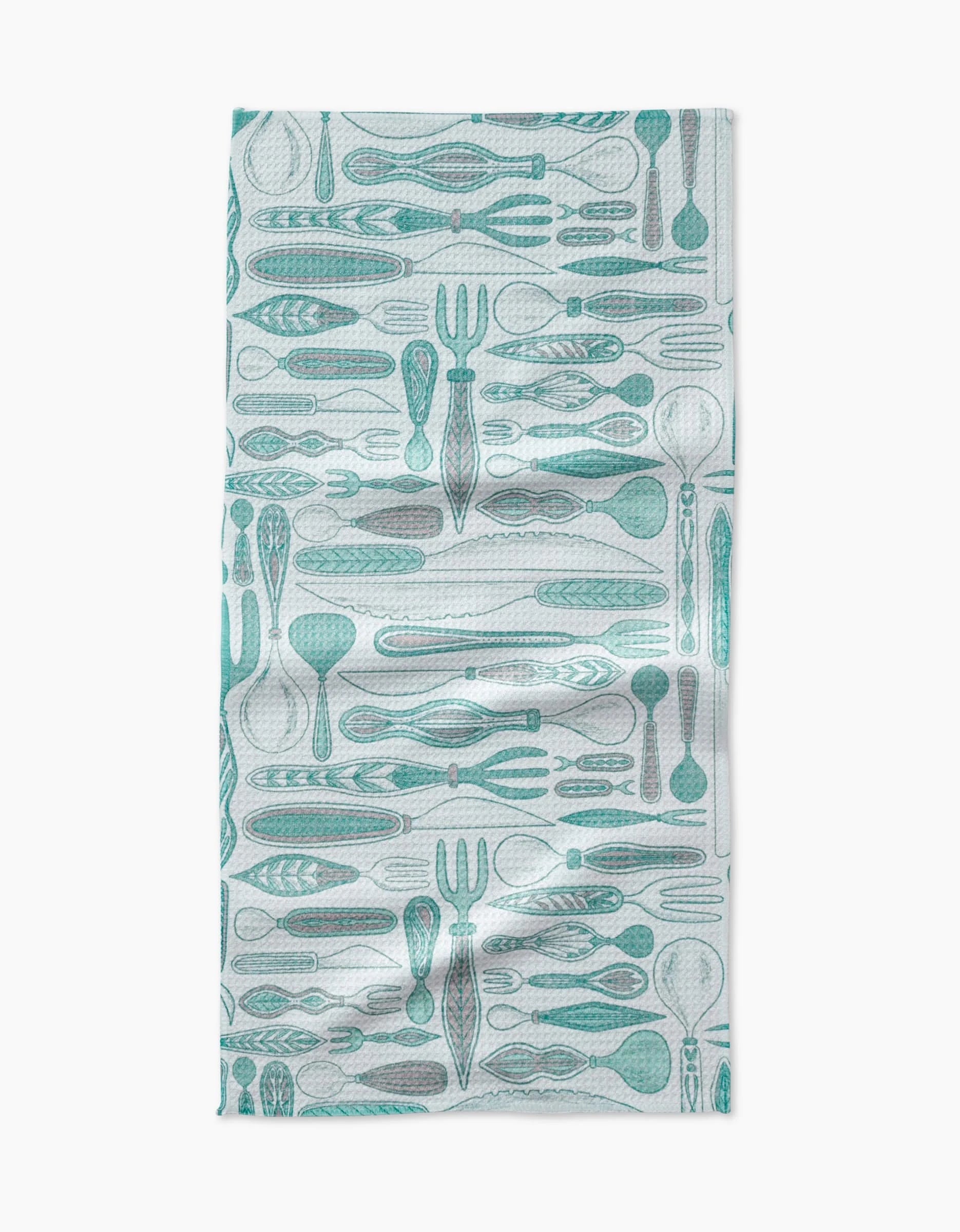 The Romy Bar Towel by Amy MacCready features a teal kitchen utensil pattern on white and is made from ultra-absorbent Geoweave fabric for superior drying power in your kitchen.