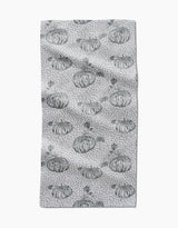 The Sage Pumpkin Field bar towel by Charlie Rowan Designs features hand-drawn pumpkins and dark gray dots evenly spaced across Geoweave fabric, creating a charming pattern on a slightly textured surface.
