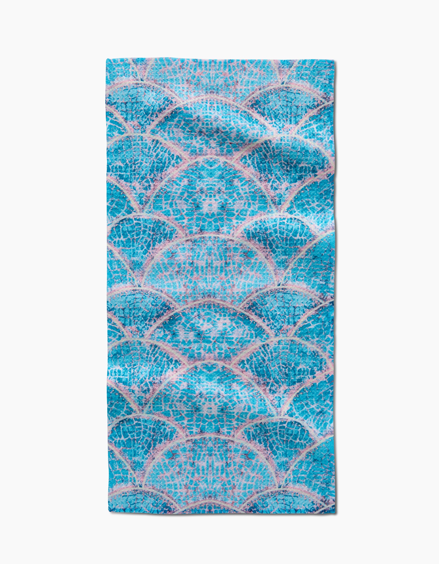 The Scallop Hills bar towel by Taryn Brennan features overlapping blue and teal scales outlined in pink on white, with absorbent Geoweave fabric for effective drying.