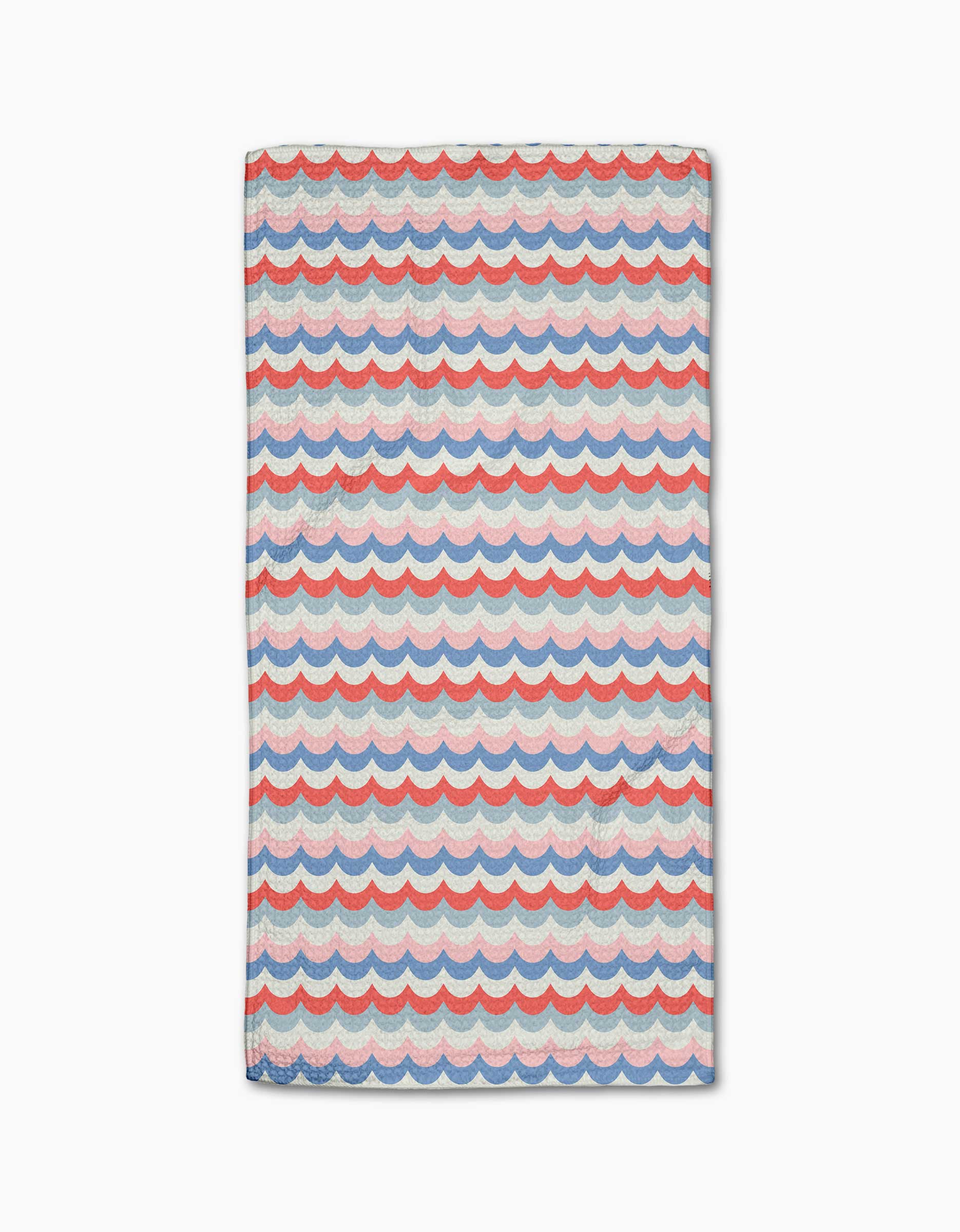 The Geometry Scallop Stripes Bar Towel features a blue, red, and white scalloped wave pattern on cream. Made from durable Geoweave fabric for superior absorbency and quick drying, shown flat on a white surface.