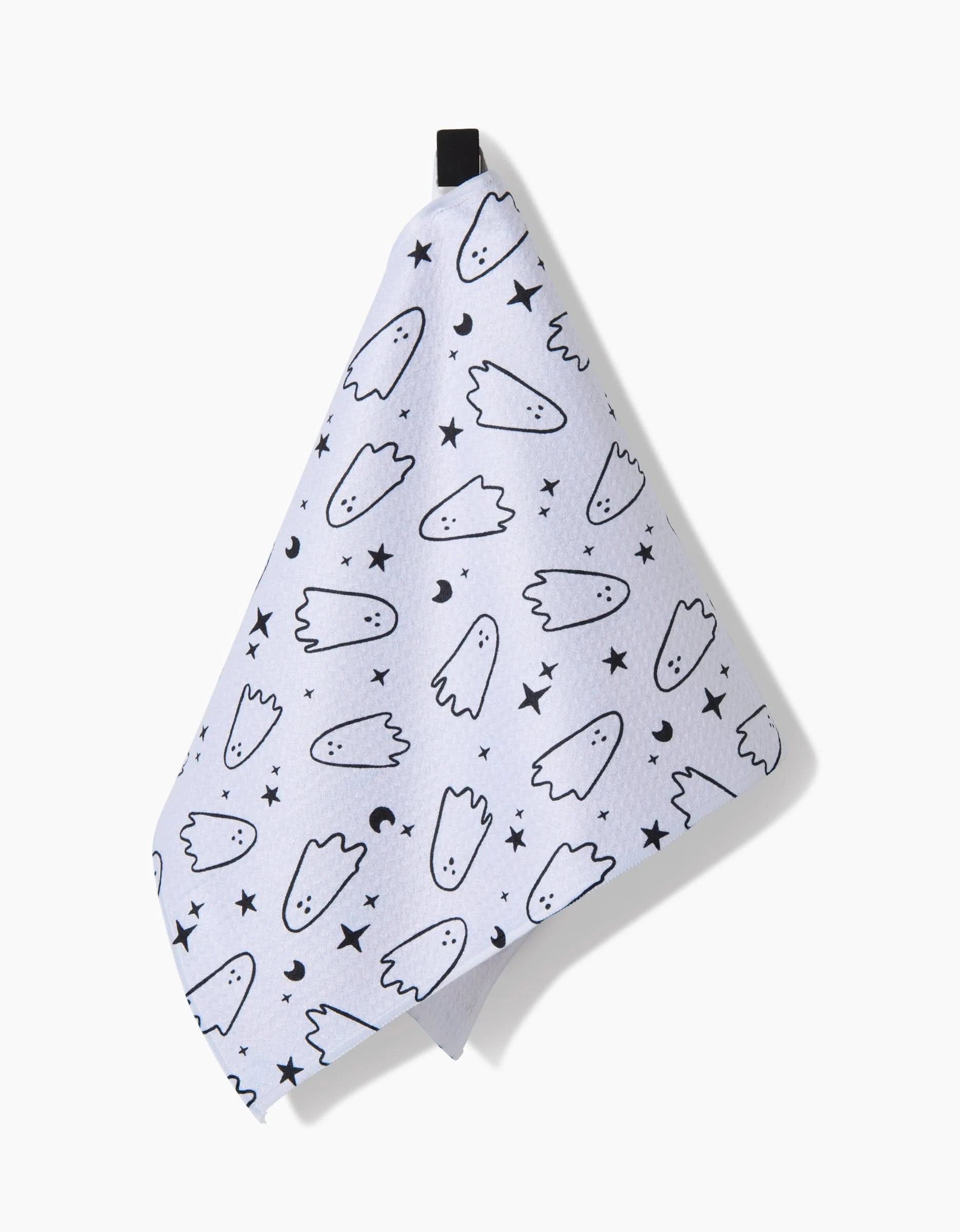 The Space Ghosts Outline towel by Hufton Studio is a white, ultra-absorbent towel with a black loop, decorated with cartoon ghosts, stars, and crescent moons.