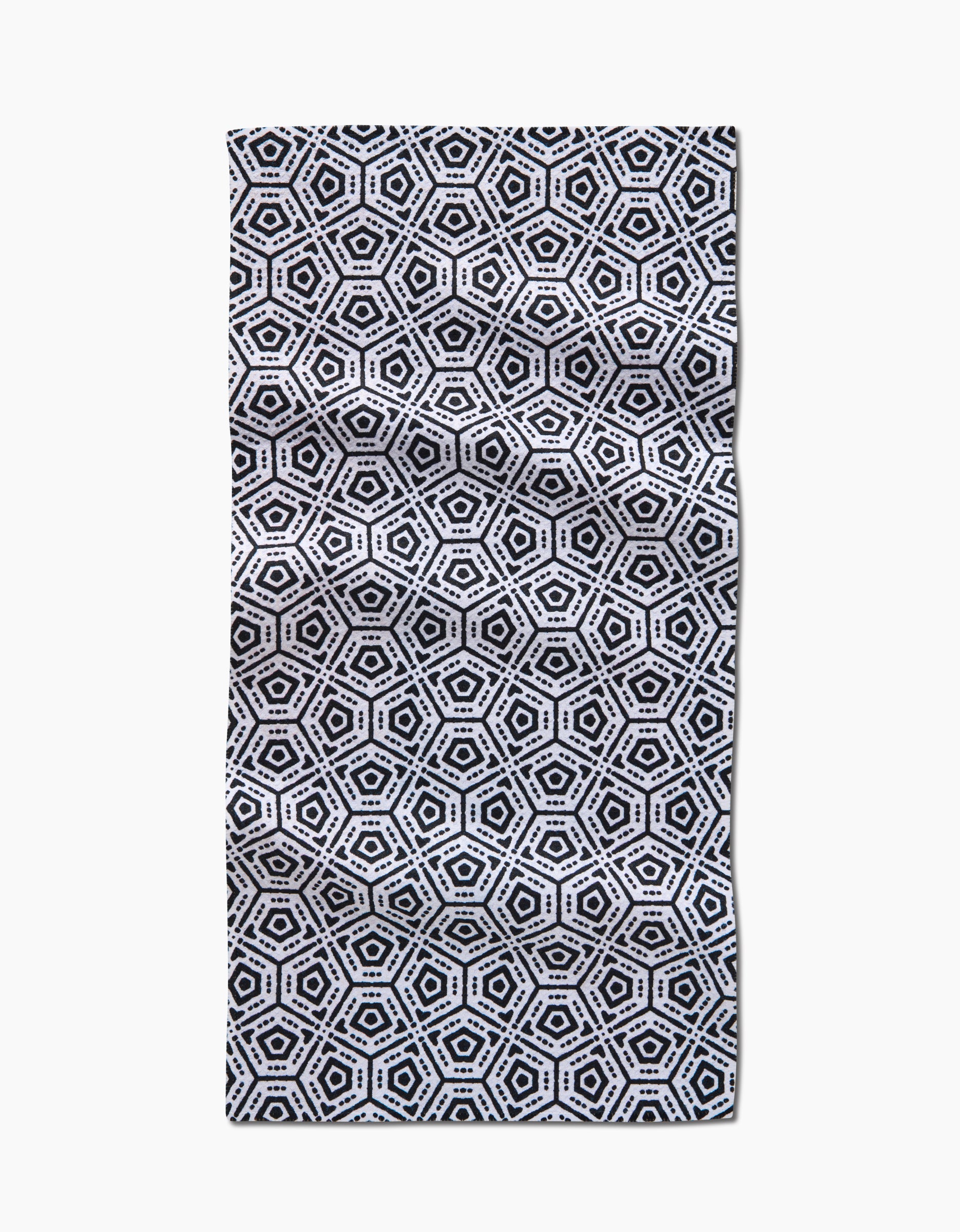 The Squeezebox Bar Towel by Katherine Berkeley showcases a repeating black and white hexagonal geometric pattern with concentric shapes and small dots, all crafted from durable Geoweave™ fabric for a striking, symmetrical look.