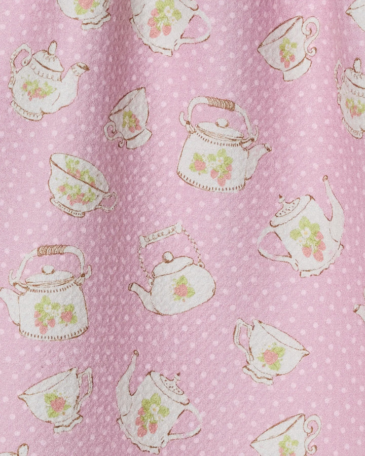 The Geometry Strawberry Tea bar towel features Geoweave fabric in pink with white polka dots and charming teapot and teacup floral illustrations.