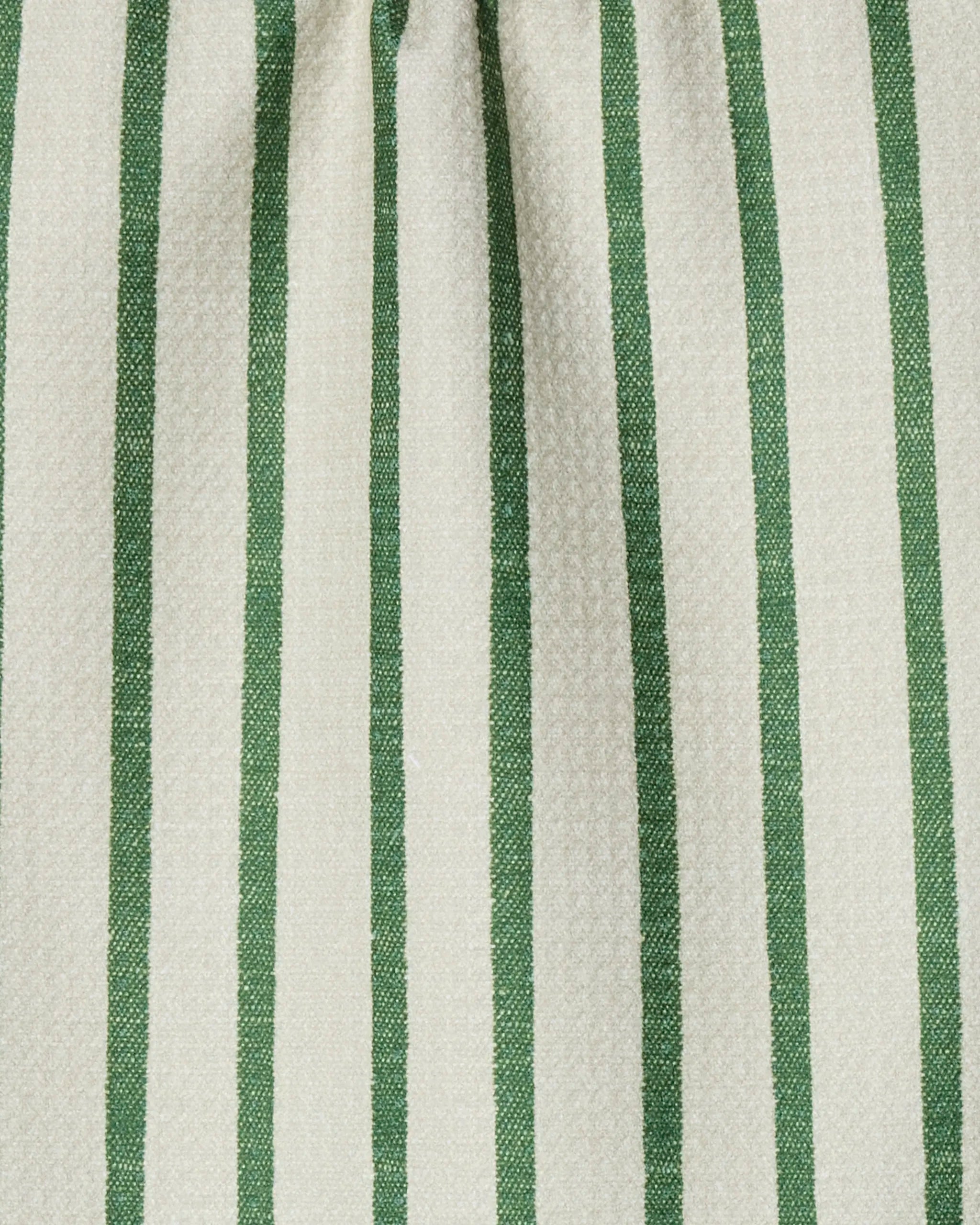 Close-up of Geometry’s Striped Path bar towel featuring a cream background with vertical green stripes. Made from ultra-absorbent recycled materials, it blends style and sustainability.