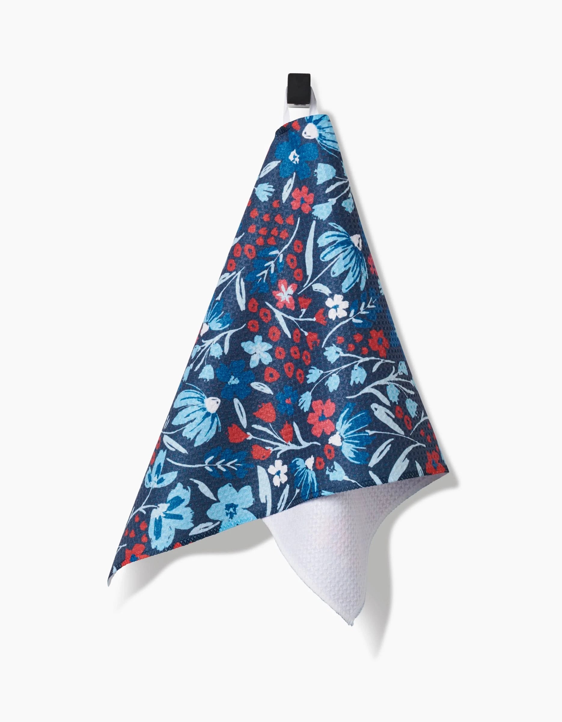 The Hufton Studio Summer Bloom bar towel features a red, white, and light blue floral pattern on blue Geoweave fabric for superior absorbency, and hangs from a black loop against a white background.