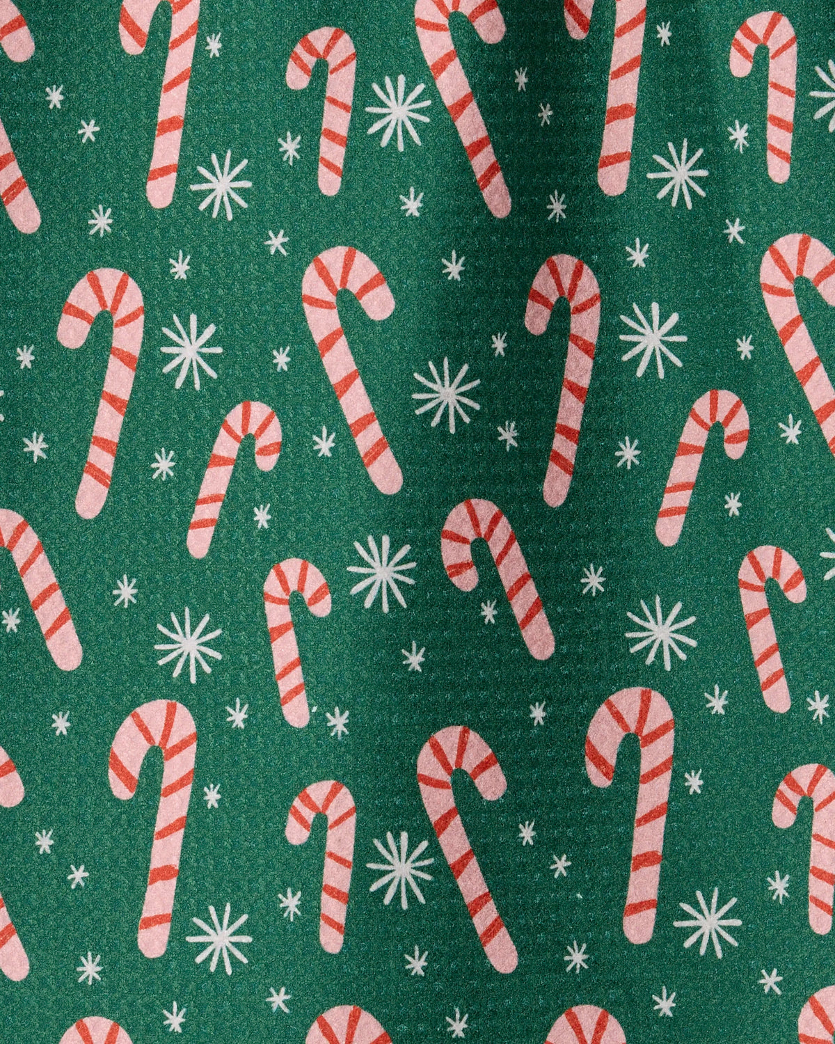 Green background with a repeating pattern of red and white candy canes and white snowflakes, the “Sweet Candy” mini towel by Geometry evokes a festive holiday or Christmas theme. Crafted from durable Geoweave fabric, this towel is both stylish and sustainable—making it an eco-friendly choice for the season.