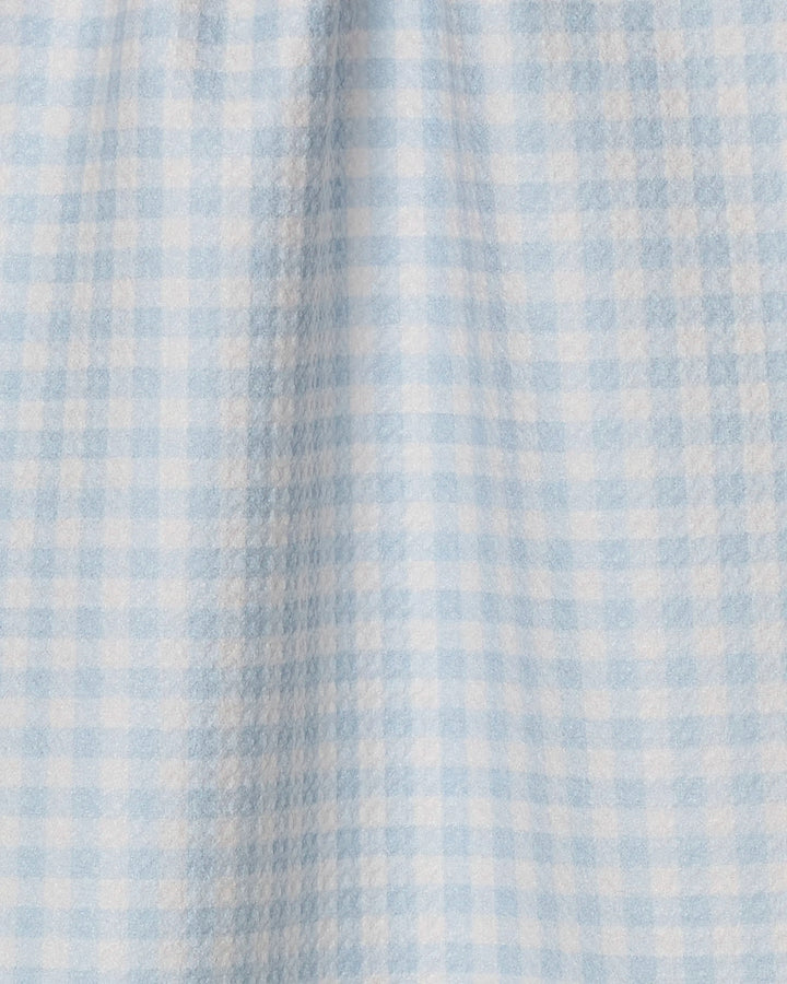 The Sweet McKelle bar towel by Geometry features a light blue and white gingham checkered pattern with small squares and subtle vertical folds on its ultra-absorbent fabric.