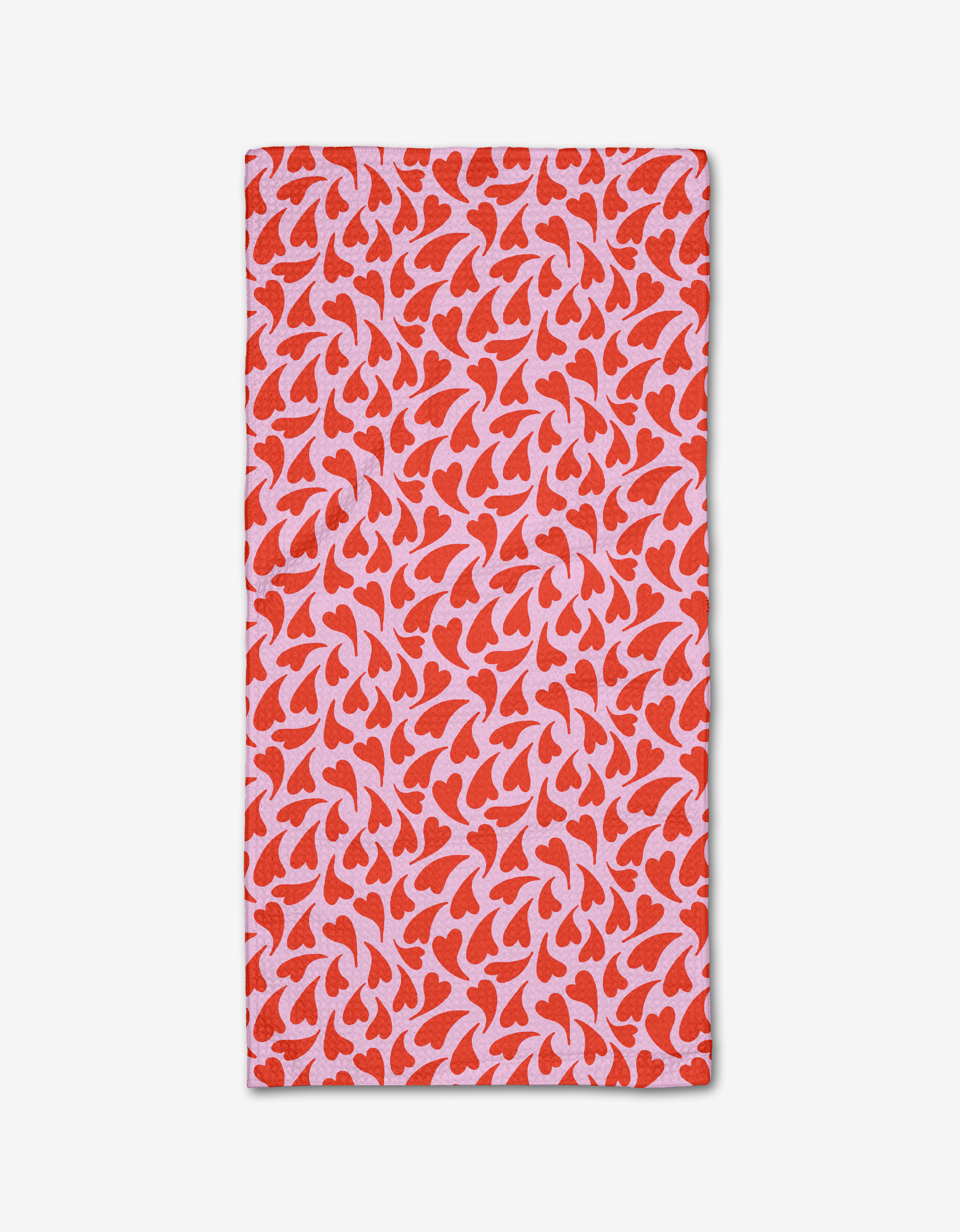 The Kayla Ann Swooning Hearts bar towel features red and pink abstract heart motifs on a light pink background, displayed flat on a white surface.
