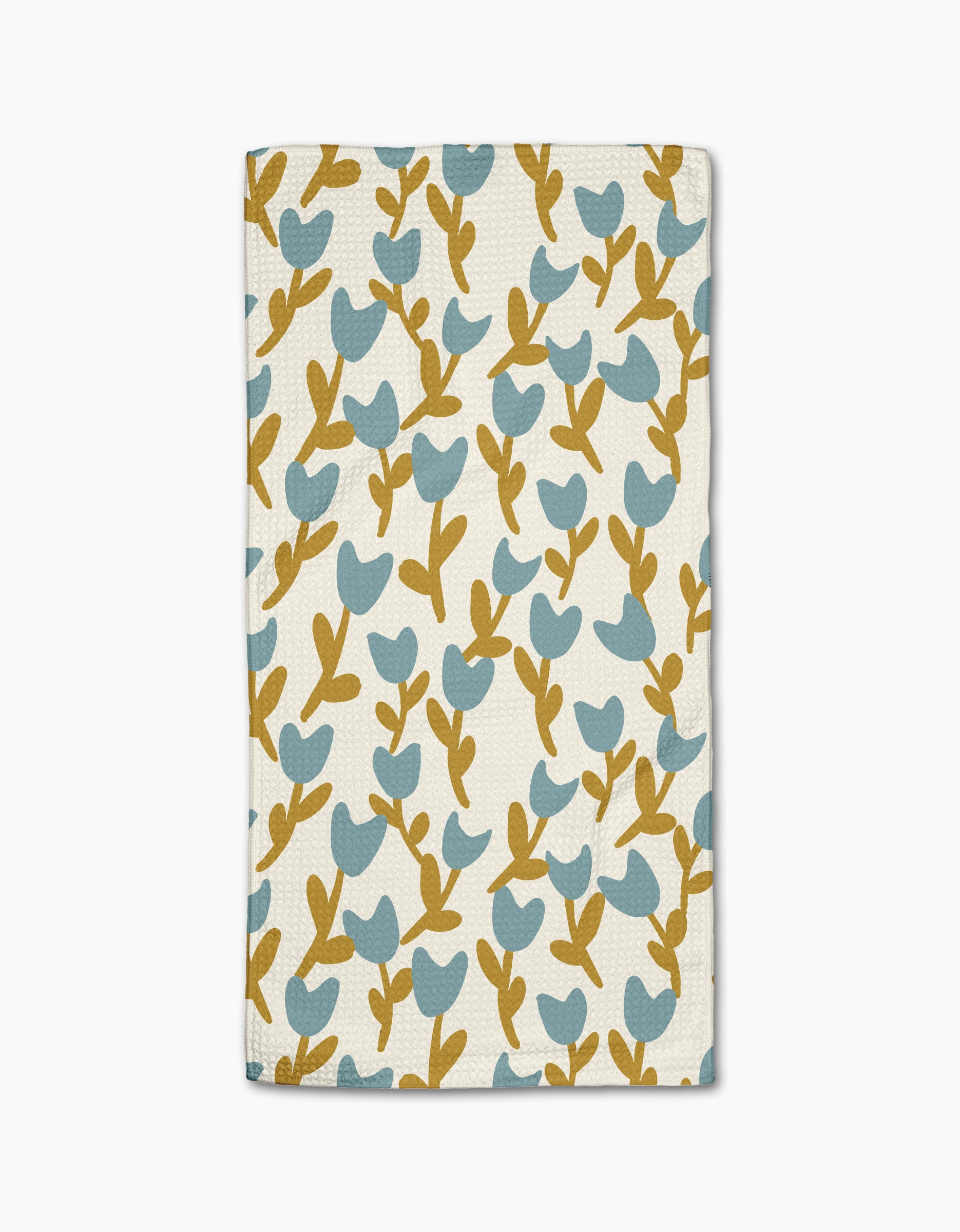 Tulip Garden by Lizzie Clark is a folded white cloth napkin with a blue tulip floral pattern and brown stems, made from recycled materials for an eco-friendly touch.