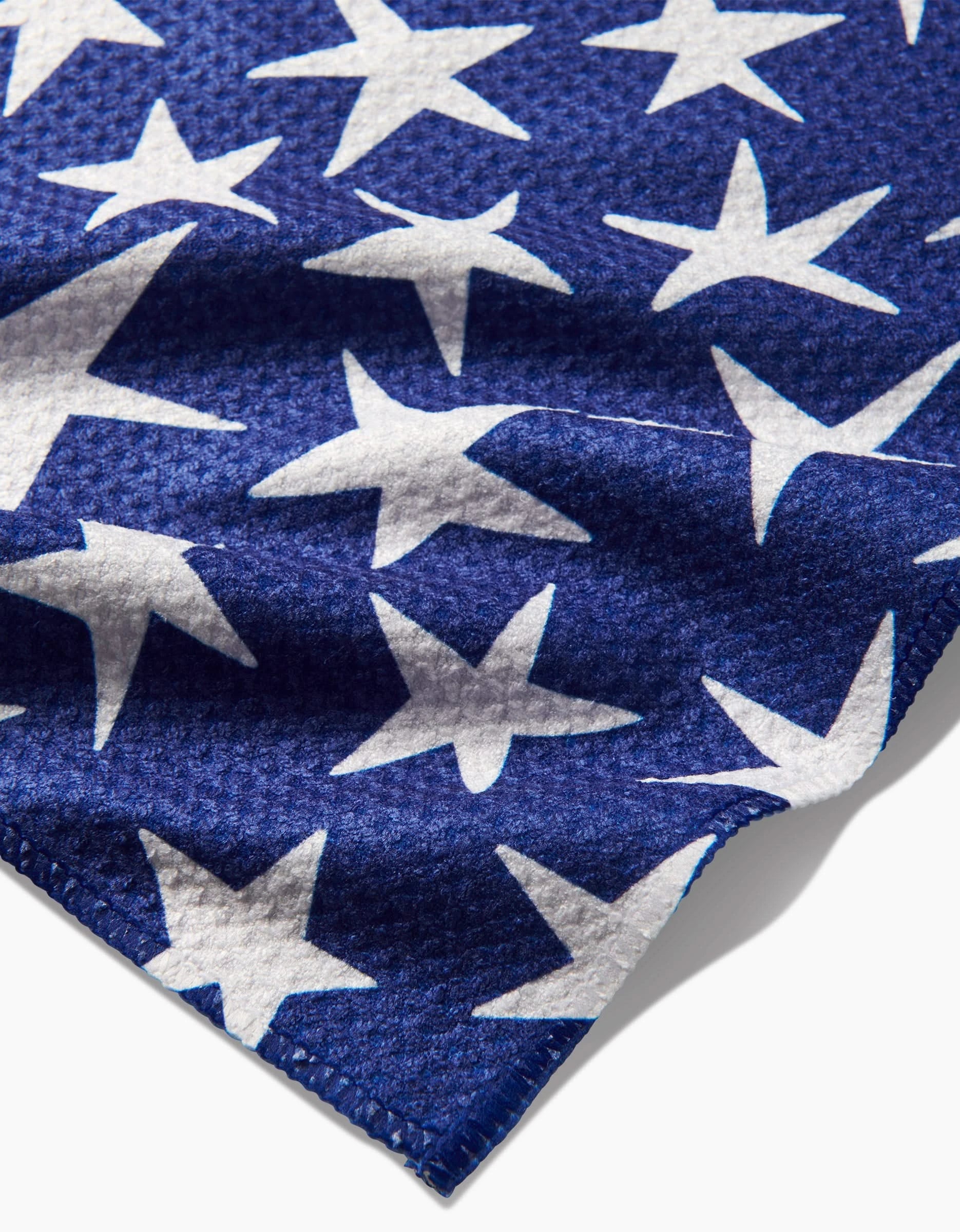 Close-up of Mindfulnice’s USA Stars Geoweave fabric, featuring white stars on blue, reminiscent of the U.S. flag, highlighting detailed texture and edge stitching.