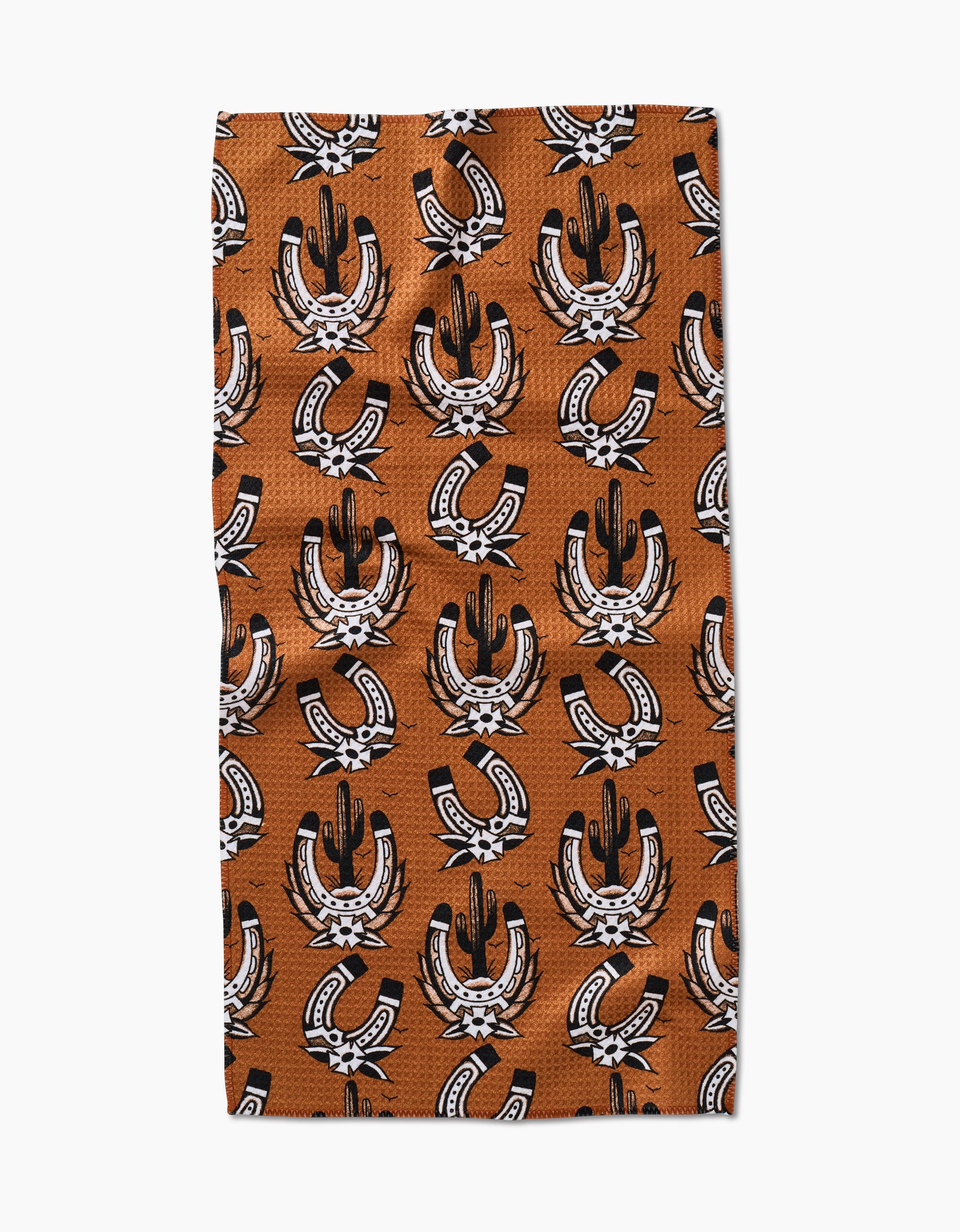 The Cole Strem Western Horseshoes Bar Towel features black cacti inside white horseshoes with black and white accents on a brown background, made from Geoweave fabric for superior absorbency and durability.