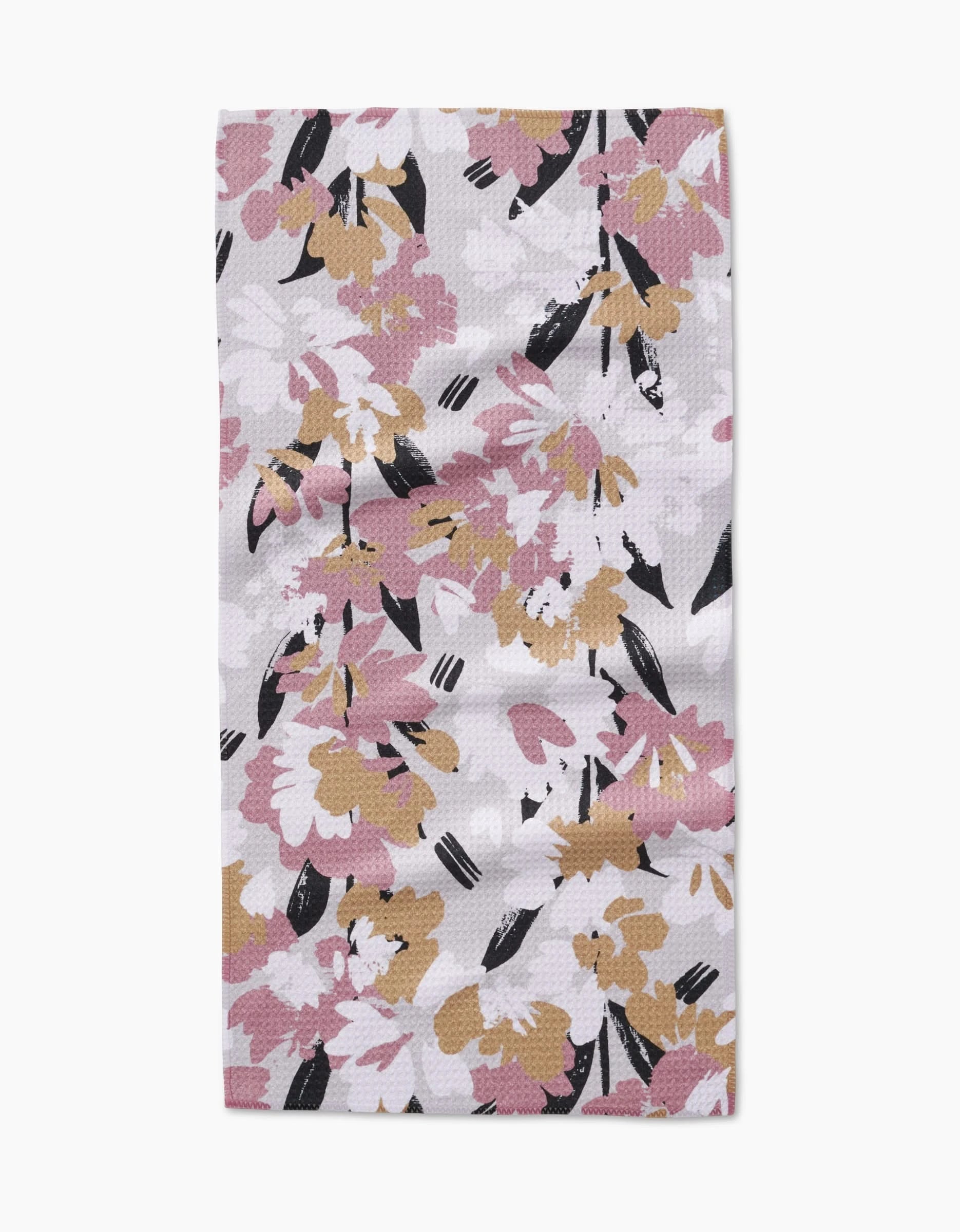 The Wilderness Floral Bar Towel by Toboggan Avenue features an abstract, colorful floral pattern on a light background, crafted from recycled materials for an eco-friendly touch.