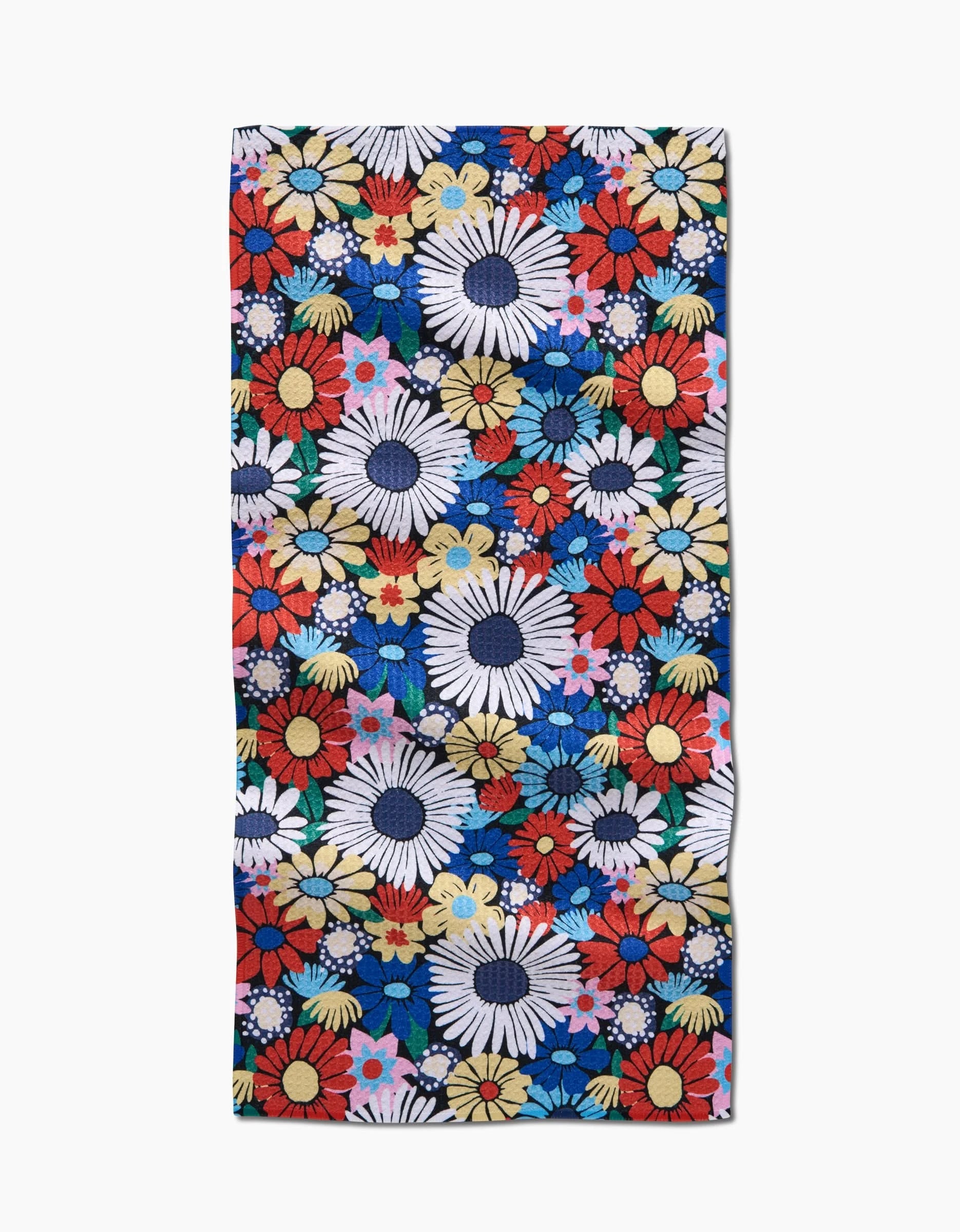 The Wildflowers Bouquet bar towel by Claire Iglesias features a vibrant pattern of colorful flowers, including daisies and small blooms, on a deep blue background. Made from recycled materials.