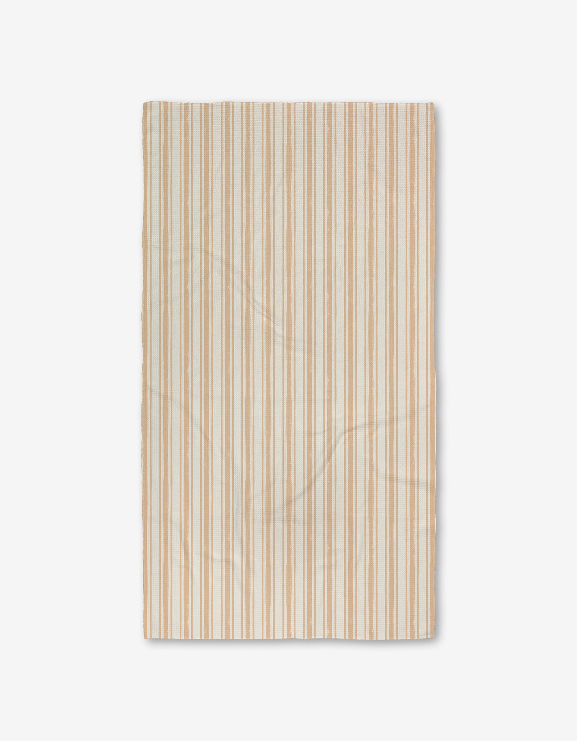 The Boho Stripe Luxe Bath Towel by Hufton Studio is a rectangular beige towel with thin tan and light brown stripes, featuring ultra-absorbent Geoweave fabric. It is shown flat on a white background with subtle texture and slight creases.
