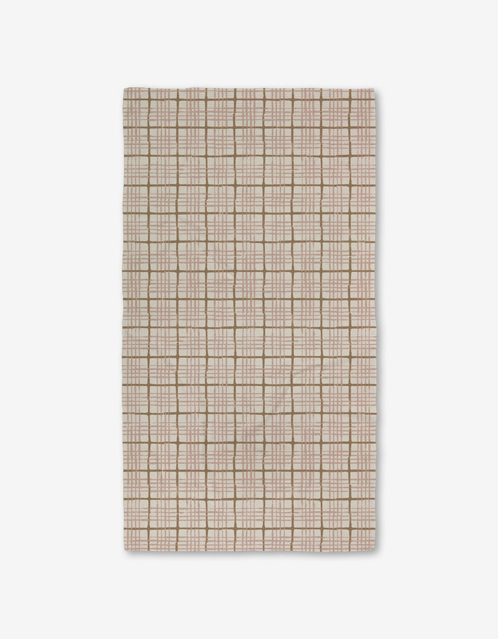 The Crossover by Studio Jeannot is a rectangular beige textile featuring a grid of light brown and white lines with small square and rectangular accents. Made with Geoweave technology, it offers a soft, textured, and highly durable surface.