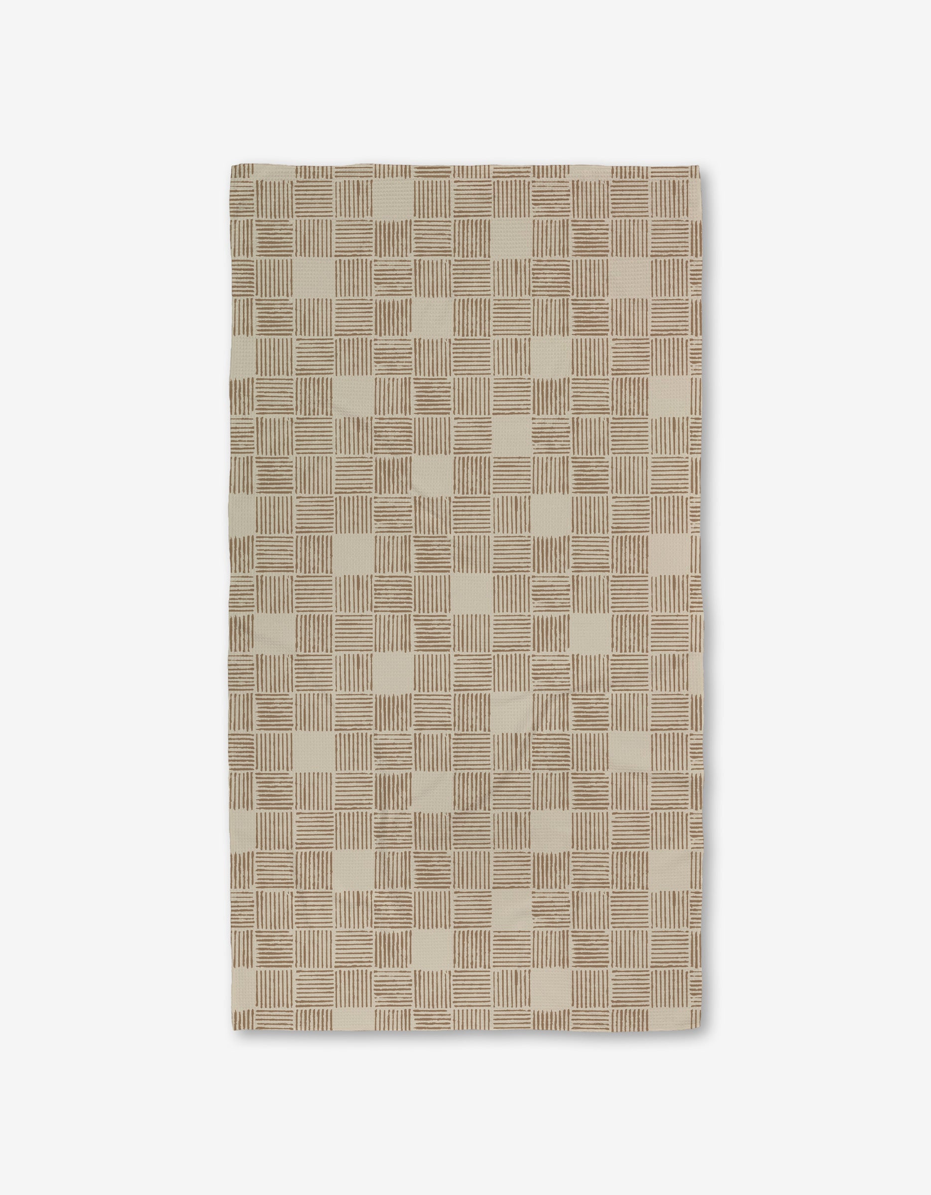 The Thatcher rug by Studio Jeannot is a rectangular beige rug with a geometric checkerboard of small squares and parallel brown lines, made from recycled materials. Shown on a white background.