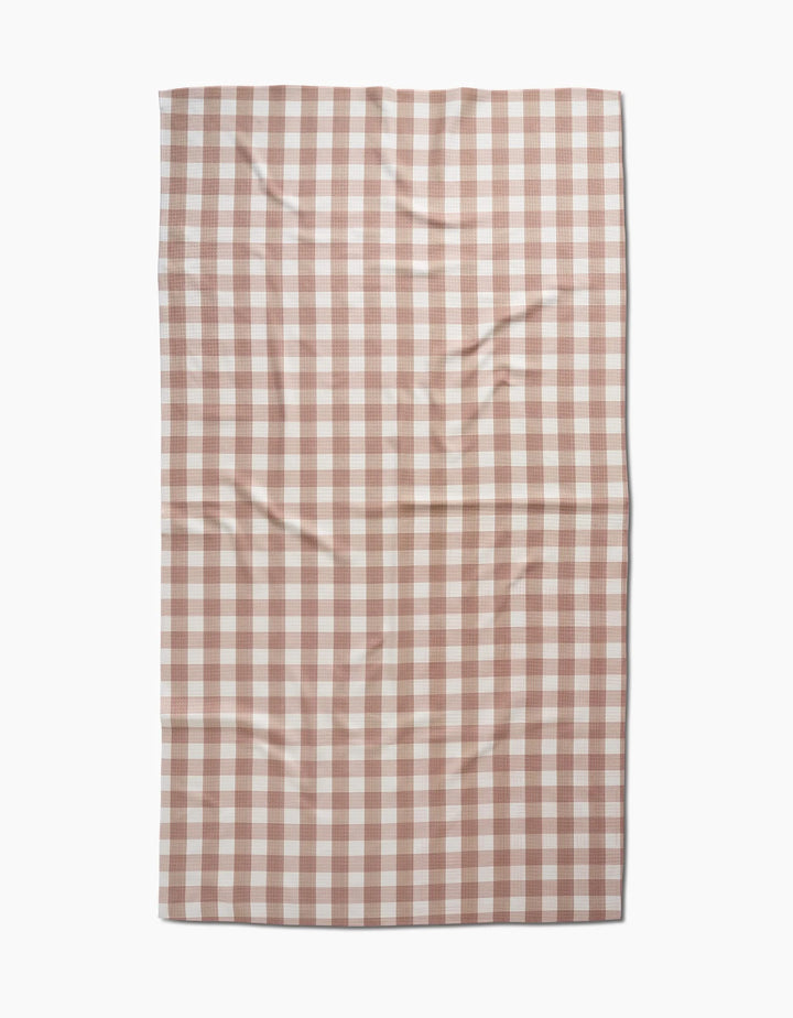 The Hufton Studio Vintage Gingham Natural is a rectangular Luxe Bath Towel in a brown and white checkered pattern, crafted from ultra-absorbent recycled materials and shown laid flat with visible creases.