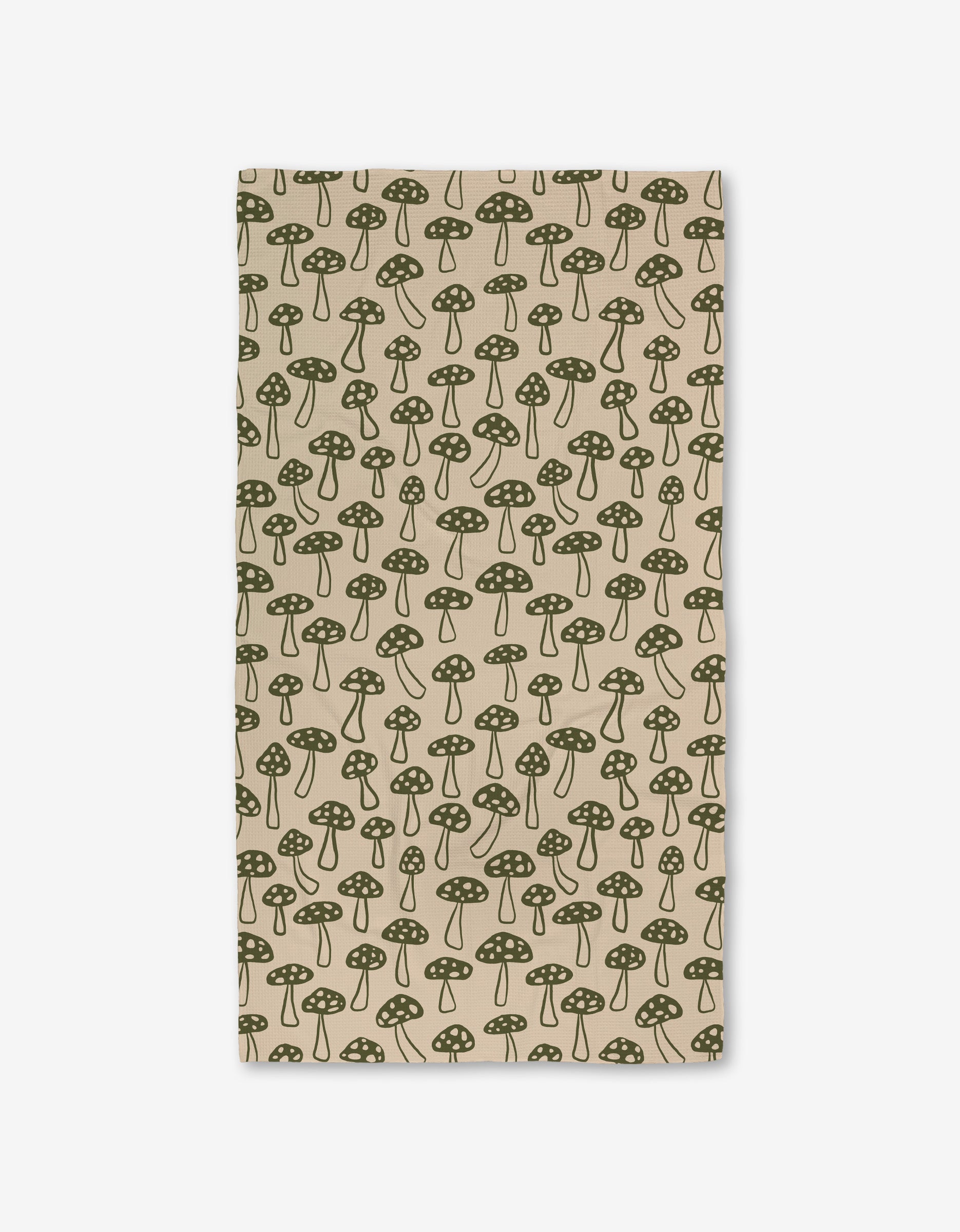 The Woodland Mushroom by Kayla Ann is a beige rectangular cloth with a green dotted mushroom pattern, evenly spaced and made from ultra-absorbent recycled materials.