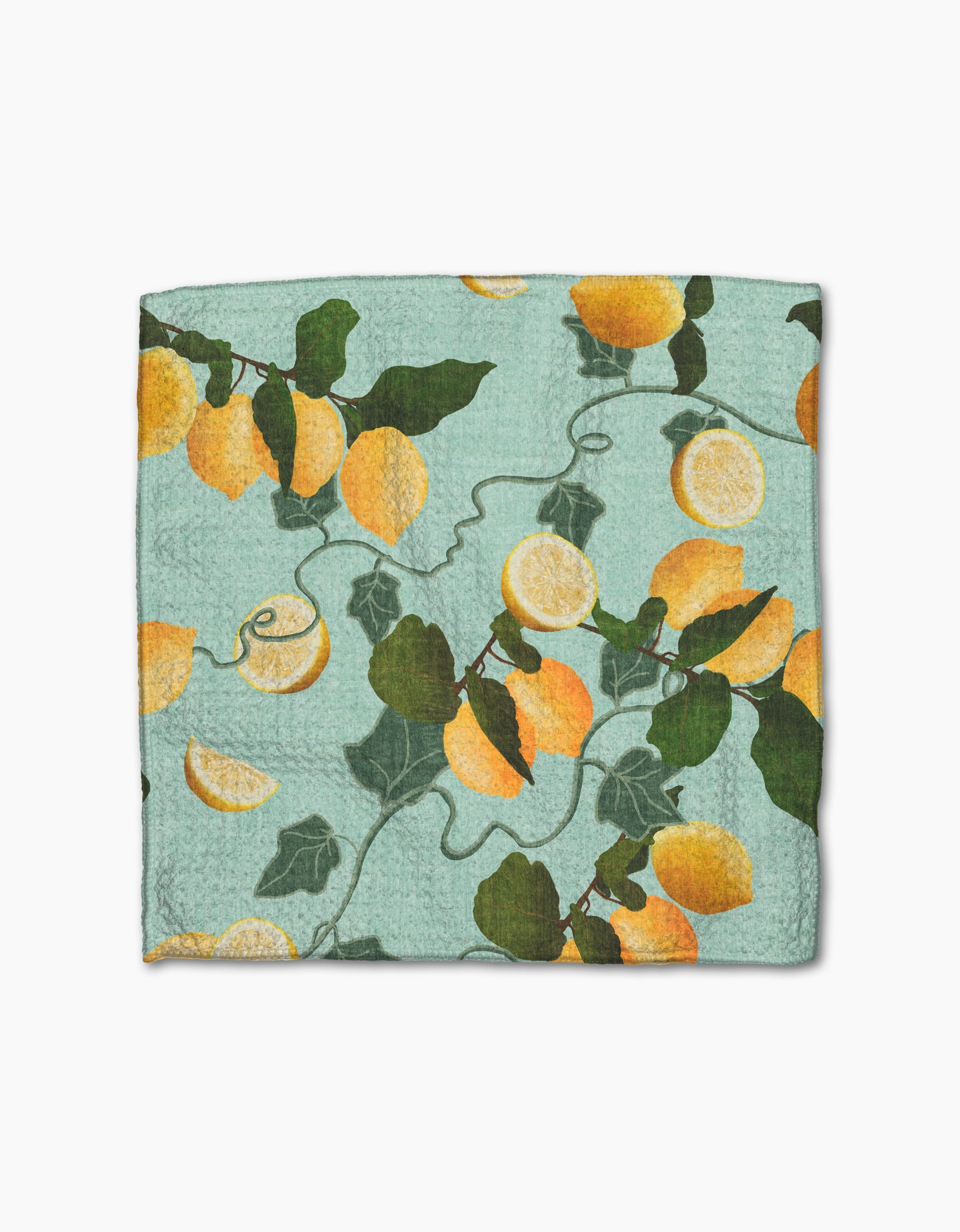 The Amalfi Lemon dishcloth by Pascale Dilger is blue, made from recycled materials, and features yellow lemons, lemon halves, and green leaves with vines.